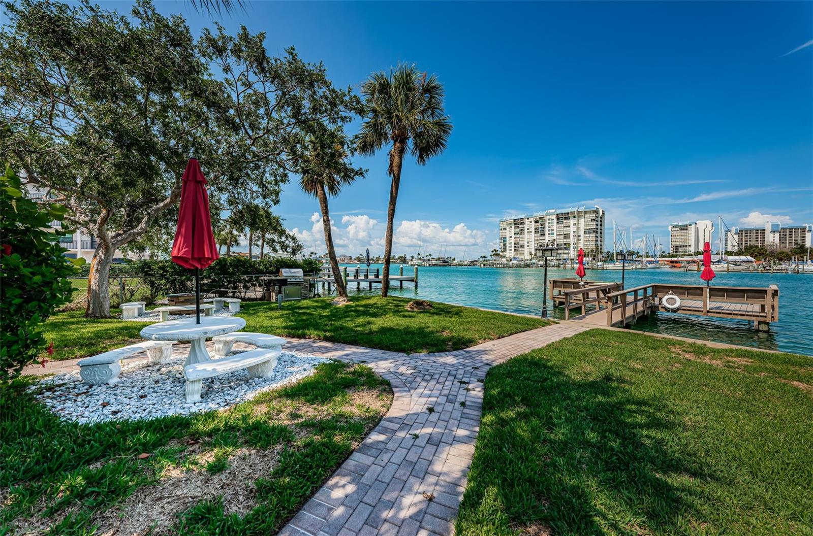 Beautifully updated and Fully Furnished condo just steps to the sand!! Treasure Island Getaway one block from the beach. One bedroom one bath condo on the first floor with assigned parking next to front door. Well designed Kitchen with custom cabinets and granite countertops, brand new appliances with Built in Microwave. Porcelain tile flooring throughout!! No steps to climb. Amenities include Water Front complex, Dock to fish or day park your boat, Block construction, Laundry room close to unit. Water, sewage, trash, included with rent.