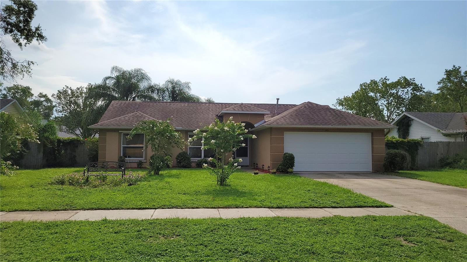 DELAND: Nestled in the tranquil Heather Glen neighborhood this meticulously maintained home radiates both modern charm and calming serenity. Step inside to discover a beautifully updated kitchen adorned with sleek countertops and gleaming stainless steel appliances, all part of an open floor plan bathed in warm, natural tones that evoke a sense of peace and comfort. Stylish flooring, updated plumbing, and a newer air conditioning system complement the fresh feel throughout, while a new garage door and opener add to its functionality. The spacious bedrooms provide ample room to unwind, with the master suite featuring a generous walk-in closet. Outside, the fully fenced backyard is a true oasis — a lush canvas of palm trees, crape myrtles, and passion flowers, all enjoyed from the expansive covered and screened porch that overlooks the perfectly landscaped grounds. An additional bonus room, currently styled as an office, easily transforms into a third bedroom with the addition of a closet — offering flexibility for your lifestyle and space needs.