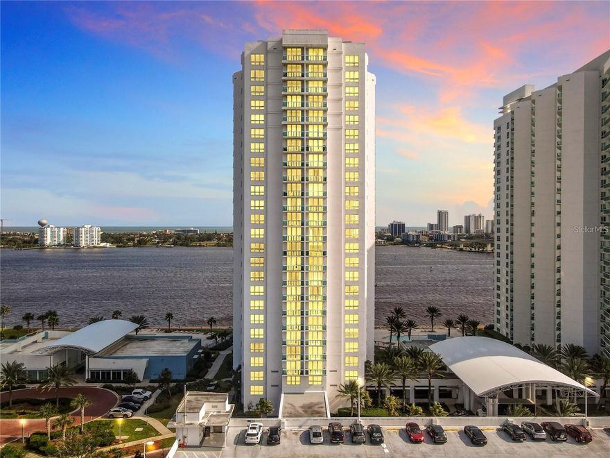 Gorgeous 3 bedroom, 3 bath condo in one of the area’s newest and most luxurious riverfront complexes. Have BREATHTAKING views from this 18th floor unit featuring a fantastic flowing floor plan and a gorgeous kitchen with stunning granite, modern custom cabinetry, stainless steel appliances, and a great breakfast bar that opens to the spacious dining and living areas. Enjoy spectacular high rise views from the balcony off the large living area that boasts fresh paint, new 5-inch baseboards and new flooring in all bedrooms. Rest easy in the 3 super spacious bedrooms and 3 gorgeous spa-like bathrooms. Best of all, this high luxury condo community offers you unbeatable resort-style amenities, 2 heated pools, large sun decks, Jacuzzi, 18 seat private movie theater, state of the art fitness center, yoga/dance studio, sauna, formal banquet room, private party rooms, big screen theater room, billiards room, on-site management, gated entrances, 24-hr security, security systems, secure parking garage, storage areas & more. And the location of this place couldn’t be more convenient, with beautiful parks, marinas, and downtown hotspots just outside your doors, and world famous beach spots and tourist attractions situated just a few minutes away. This is THE ONE you’ve been waiting for. Furniture is included.  Don’t delay, schedule your showing today!  Less than one hour to Orlando International airport & minutes to major highways I-4 & I95.