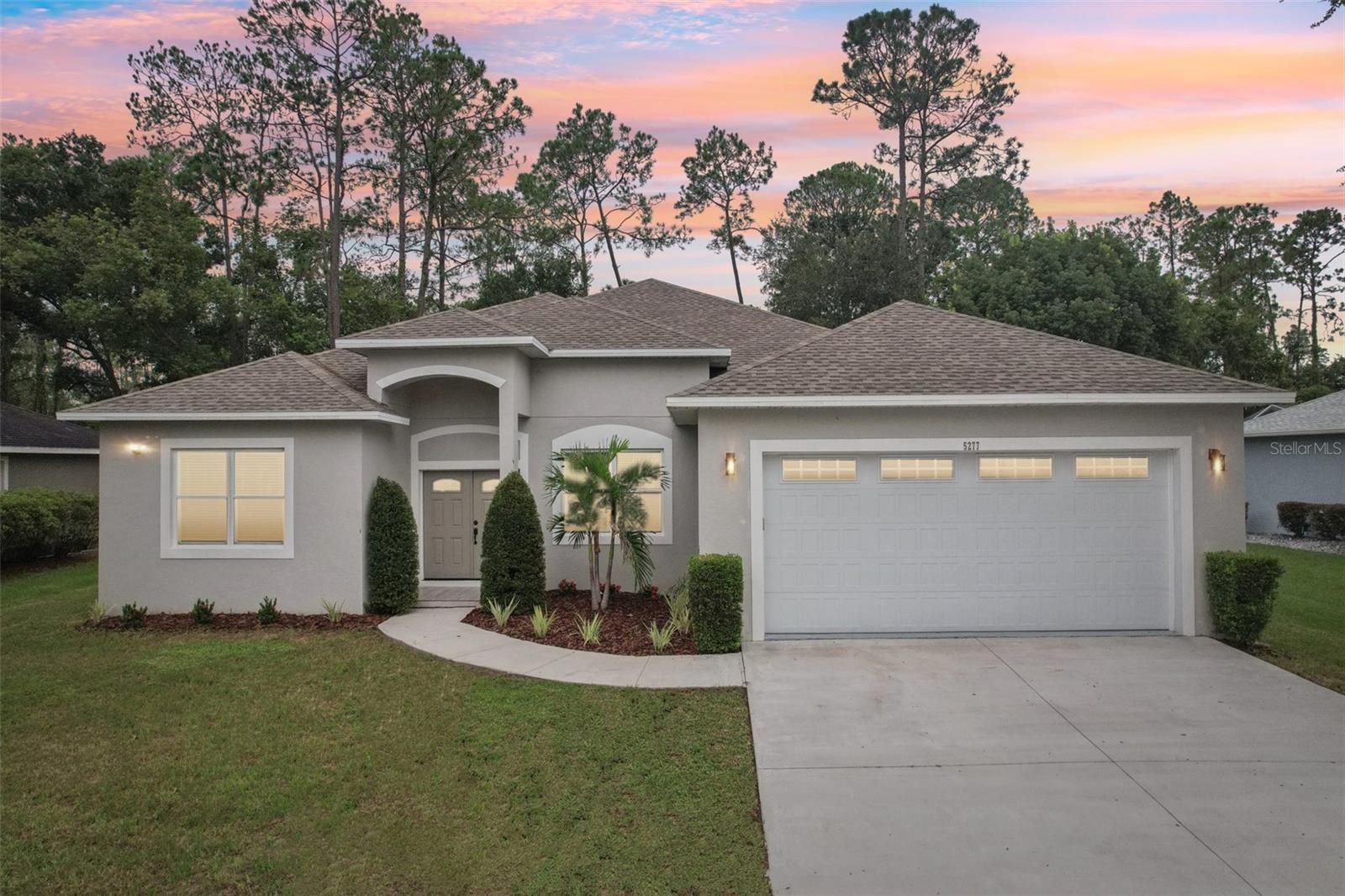 One or more photo(s) has been virtually staged. Discover the perfect blend of modern luxury and serene nature in this immaculate 4-bedroom, 3-bathroom home, BUILT IN 2022 AND SITUATED ON A CONSERVATION LOT WITH A GOLF COURSE VIEW. Located in the coveted Lake Bernadette community, this home offers an exceptional lifestyle with NO CDD fees and a LOW HOA.
You'll be impressed by the EXPANSIVE OPEN-CONCEPT FLOOR PLAN, accentuated by HIGH CEILINGS, generous RECESSED LIGHTING, and beautiful, CONTINUOUS FLOORING THROUGHOUT—ABSOLUTELY NO CARPET! The stunning kitchen features gleaming QUARTZ COUNTERTOPS, SOFT-CLOSE SOLID WOOD CABINETRY, STAINLESS STEEL APPLIANCES, AND A MASSIVE CENTER island perfect for meal prep and entertaining.
Designed for privacy and comfort, the SPLIT BEDROOM LAYOUT provides a peaceful owner's retreat. Your private sanctuary includes a spa-like ensuite bathroom with a LUXURIOUS SOAKING TUB, A SEPARATE FRAMELESS GLASS WALK-IN SHOWER, and ample space to unwind.
The seamless indoor-outdoor living is perfected by an EXPANSIVE SCREENED PATIO, where you can enjoy your morning coffee or evening sunsets overlooking the tranquil conservation area and pristine golf course. The patio is already plumbed for your future dream outdoor kitchen!
This TECHNOLOGICALLY ADVANCED SMART HOME is equipped with CAT 6+ WIRING, LUTRON SMART LIGHTING, and is PRE-WIRED FOR SURROUND SOUND, offering ultimate convenience and entertainment possibilities. A large, dedicated laundry room with extra counter space and cabinetry adds to the home's incredible functionality.
Enjoy the RESORT-STYLE AMENITIES of Lake Bernadette, including two pools, a fitness center, tennis and basketball courts, and a playground. This prime location offers the charm of Zephyrhills with the convenience of being just one mile from the Wesley Chapel line. You're minutes from I-75 for an easy commute to downtown Tampa, and close to world-class shopping and dining at Tampa Premium Outlets, The Shops at Wiregrass, and The Grove.