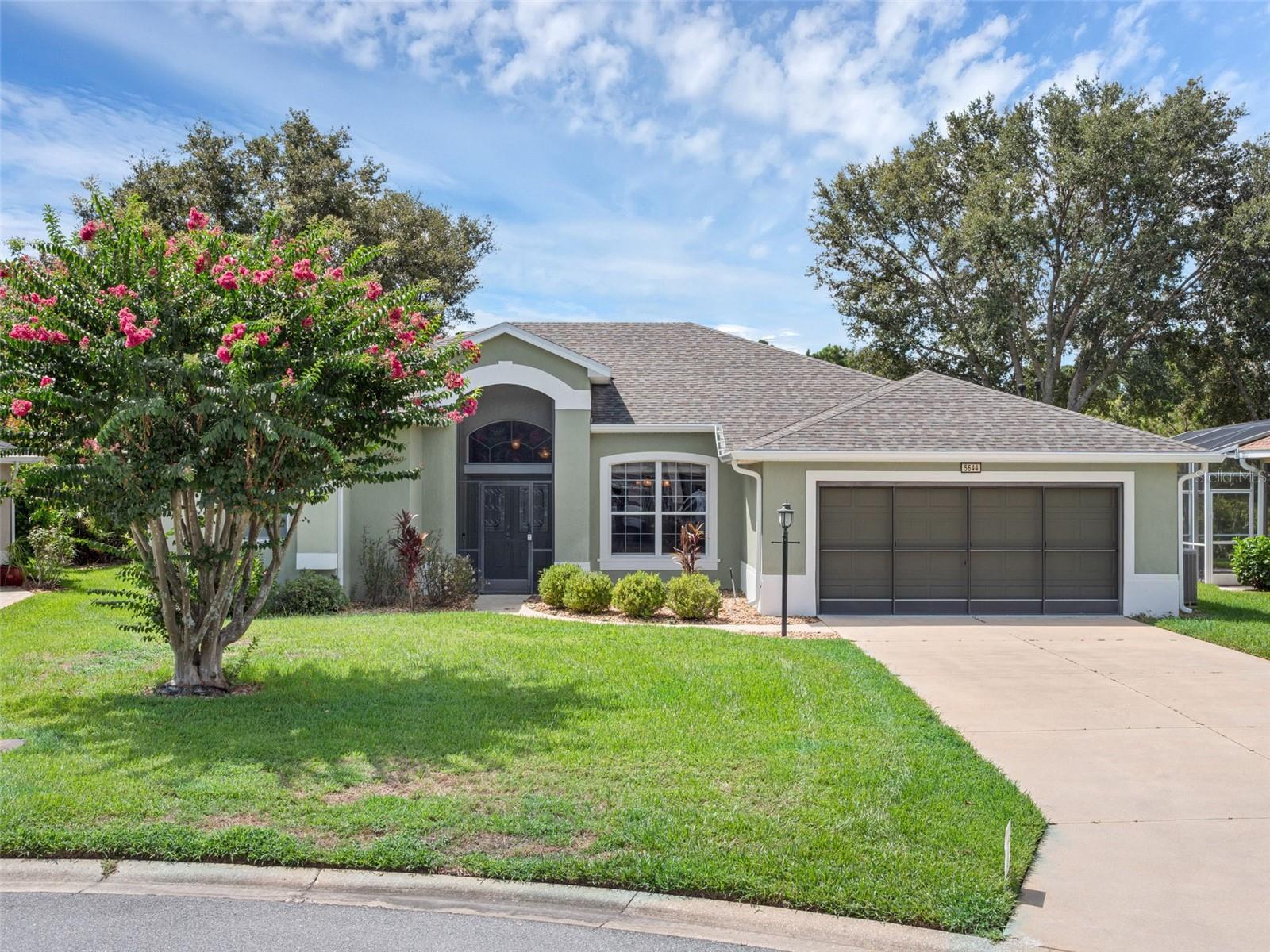 One or more photo(s) has been virtually staged. Wow! Brand New 2025 Roof! This popular Scarborough Model home offers nearly 2000 square feet of under-air living space PLUS a huge enclosed Florida Room AND an even bigger screened lanai with patio pavers, BBQ gas line, invisible pet fence, and gorgeous landscaping! Nestled in a quiet cul-de-sac with conservation views and a long driveway that can easily accommodate six vehicles, you'll love how well-maintained this property is. The garage has a sliding screen, attic storage, pegboard, and a workbench. The foyer's double door entry allows for an easy move-in, and you'll have lots of space to set up your new Florida home. As you step in, your eyes are drawn to the private backyard, tray ceilings in the formal dining area, and the architectural design. Arches, automatic boxed blinds for privacy, large rooms, and built-ins give this home a custom feel, ready for its new owners. The kitchen is equipped with newer stainless steel appliances, granite counters, wood cabinets, pull-outs, pantry, and eating space at the high-bar. The Scarborough Model was designed for residents who love entertaining guests and hosting family members. With the split bedroom floor plan, spacious formal and casual living & dining, the Scarborough allows you the freedom of multiple spaces to charm your guests and create areas to relax and restore. The family room has built-in cabinets and TV hardware in place for Nascar and Football Sundays with friends! The inside laundry is phenomenal! Speed Queen washer & dryer, folding counter, cabinets, and a sink for all your cleaning needs. If details are what you are looking for, consider the crown molding in the kitchen, dinette, and family room. You'll appreciate all the custom closets, skylights, Jacuzzi tub, and pocket doors. Don't delay! Book your private tour today! Royal Highlands is a 55+ gated, golf community with two pools, Great Hall, fitness center, courts, library and craft room. Enjoy the fulll-service restaurant, driving range, softball field, and too many clubs to mention! Close to the Florida Turnpike, I-75, The Villages Squares, MCO, Disney, shopping and medical facilities! Come see what Central Florida Lake County has to offer you!
