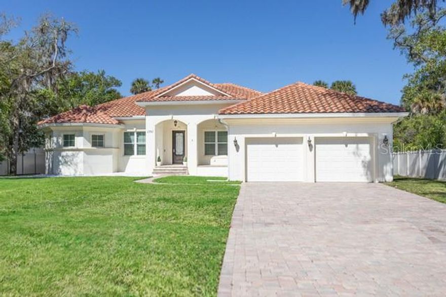 Experience refined coastal living in this exceptional residence!
Designed with elegance and comfort in mind, this stunning 4-bedroom, 3-full bath home offers an elevated lifestyle just minutes from the sun and surf of Flagler Beach.  Step inside to discover a bright and open floor plan featuring a formal living room, dining room plus a spacious family room, ideal for everyday living and entertaining.  A private study provides the perfect retreat for remote work, reading or creative pursuits.  At the center of the home, the chef's kitchen is a true showpiece.  Thoughtfully designed with premium finishes, an expansive center island, custom cabinetry, quartz countertops and premium appliances, it seamlessly blends beauty and function.                                                                                                                                                                                                                                                                                                                                                                                                                   The luxurious primary suite is generously sized and filled with natural light, a tray ceiling and en-suite bath.  The primary bath is spa-inspired, featuring a spacious walk-in shower, soaking tube and his and her vanities.  Three additional bedrooms with two well-appointed bathrooms present comfort and privacy for family and guests alike.  Every detail throughout the home reflects quality craftsmanship and timeless design. This thoughtfully upgraded home features 5" crown moldings, new luxury laminate vinyl flooring in the main living areas, lots of recessed lighting, ceiling fans, a paver driveway, walkway and a large travertine floored lanai overlooking a sizable private yard with plenty of room for a pool.  Note this home was built with a solid 4-foot stem wall foundation and the attic insulation (R-35) is Cereta Spray 5" foam spray under the entire roof, over the heated and cooled living areas, sealed and conditioned.  The propane gas tank, used for cooking, is leased not owned by the Seller.                                                                                                                                                                                                                                                                   This move-in ready home combines privacy, elegance and convenience all within a short drive to Flagler Beach, shopping and dining.                                                                                                                                                                                                                                               Don't miss this exceptional property, schedule your private showing today!