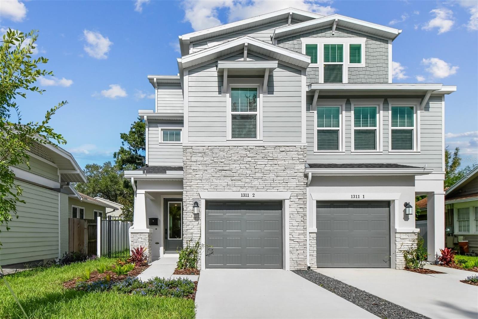 Beautifully designed 3-story townhome in the heart of SOHO, only a short 0.3-mile stroll to the waterfront sidewalk of Bayshore Boulevard and 2 ½ miles to downtown giving amazing dining options and plenty of activities from exercise, shopping or entertainment.
As you approach this home, you will quickly notice the curb appeal. Varied elevations of roof line, window placement, textures and colors really make this home stand out. This home includes a fenced in yard with over 1300sf to create your own outdoor sanctuary.
This fee-simple ownership townhome has no HOA fees, giving you freedom and flexibility. Inside, the design team has truly outdone themselves, blending warm maple and white tones with sleek matte black hardware and finishes throughout. The open and airy kitchen is a very aesthetic, featuring a white farm sink, decorative backsplash, quartz countertops, and an open floor plan ideal for entertaining and everyday family living.
The second floor boasts an oversized primary suite privately tucked into the center of the space Natural light fills the primary bathroom and includes not ONE but TWO walk in closets! An additional en-suite bedroom on the opposite side of the floor offers privacy and comfort for guests or family members. Natural light continues to pour through the stairwells, which are lined with oversized windows and feature rev-wood laminate flooring that flows throughout the home.
The third floor is designed with many options for your living preference. It includes two additional bedrooms, a bonus room, and a full bath—perfect for a home office, playroom, gym, or guest space.
A few extras…no flood insurance required, gutters, and a refrigerator included and is zoned for the highly sought-after Mitchell, Wilson, and Plant school district. This home offers peace of mind when you have a reputable builder of almost 50 years backing their warranty. Come take a tour!