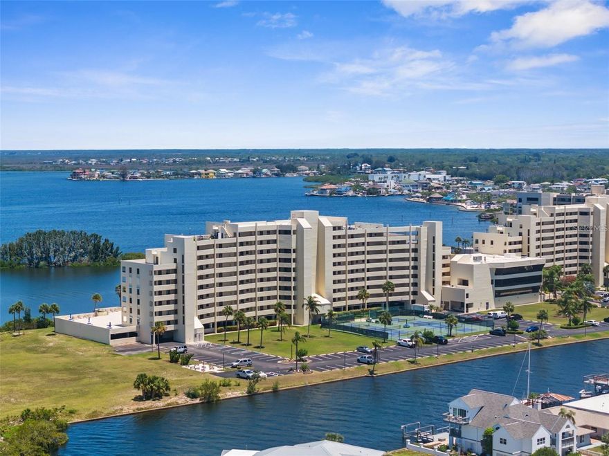 Experience the breathtaking views of the Gulf of America from the comfort of your beautifully updated and fully furnished one bedroom one bath waterfront condo located in the highly sought after Gulf Island Beach and Tennis Club community on the West Coast of Florida. Situated on the second floor this unique residence seemingly combines comfort convenience and the serenity of coastal living the spacious living area is filled with natural light and features sliding glass doors that lead to the private balcony with stunning water views. The modern kitchen is equipped with stainless steel appliances, and generous cabinet space perfect for everyday meals and entertainment. The large bedroom offers a peaceful retreat with tranquil views of the water, creating the ideal setting for rest and relaxation. The HOA fees include 24-hour guard, escrow reserve funds, insurance, cable, Internet, maintenance exterior, maintenance grounds, maintenance repairs, manager, pest control, Olympic size heated pool, pool maintenance, recreational facilities, security, sewer, trash, and water! This Resort Style Community offers a wide range of amenities designed to elevate your coastal lifestyle including a private beach and lagoon for fishing, grilling, watching dolphins, manatees, turtles and birds. It provides tennis courts, pickleball courts, a fitness centers, and sauna. Ideally located just minutes from Hudson Beach, Sunwest Beach, and several local marinas, you'll enjoy easy access to waterfront restaurants, casual tiki bars, public boat ramps, shops, golf courses, hospitals, and much more. Plus, with nearby access to I-75 and the Suncoast Parkway, you're just a short drive from the Tampa and St Petersburg / Clearwater airports, professional sports venues, and world class entertainment. Whether you're looking for a permanent residence or a vacation getaway, or an investment property, this condo i Delivers the Florida coastal lifestyle at its finest with no leasing restrictions and pet friendly. Boat slips and on-site storage units are available, adding even more value and convenience. Discover one of the Gulf Coast best kept secrets schedule your private in person or virtual showing today and start living the waterfront lifestyle you deserve!