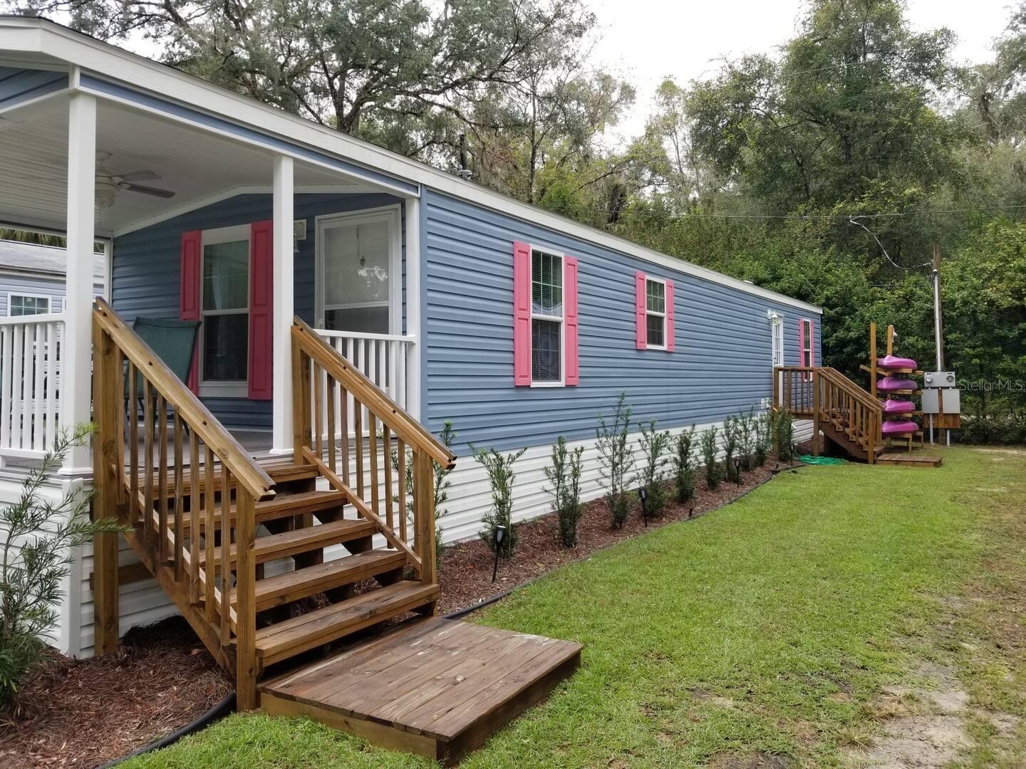 Used as an AIR BNB for the last 3 years and generates roughly $35,000+ every year l! SUMMER SPRING AND WINTER ALWAYS BOOKED! UNIT M IS BEING SOLD TURN KEY FULLY FURNISHED! Beautiful Rainbow River Springs Bungalow with FREE KP Hole access to the boat ramp and dock launch! Walking distance to the beautiful Rainbow River Springs. Fully furnished 2 bedroom, 2 bathroom with king size bed in master, queen size in guest room and a pull out couch. Home sleeps 6. This unit is one of the closest units to the walking path towards KP Hole with no neighbor's across from you! The common area within the community features grills, games, paddle board/kayak rentals and much more! Lot rent of $795 month and includes water, septic, lawn, common area amenities, maintenance and Rainbow Springs KP Hole swimming access and boat/kayak/inter-tube launch!