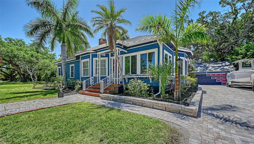 Discover the allure of historic Florida with this meticulously restored 1939 Key West Style bungalow, a cherished piece of Anna Maria Island history. With over $75K in recent upgrades this home was originally constructed in the cottage community of Sunny Shores Guest Homes at the northern tip of Anna Maria Island and was transported by barge up the Manatee River and to its current location in 1941. (The first home moved off of the island). Nestled in Bradenton’s Historic River District, this unique home embodies timeless charm and a captivating narrative. This bungalow offers a glimpse into its colorful past as it boasts a set of original design blueprints, photos and a historical recap of the homes adventures past. A perimeter of charming built-in flower boxes, mature popping-pink Azalea bushes, and the original owner’s grand piano add to the charm. Extensively updated since 2020 including a new paver driveway and backyard pool area in 2025, the property seamlessly blends period-correct renovations with modern amenities, ensuring both historical integrity and contemporary comfort. Step inside to find a welcoming Florida room featuring original quarry tile mosaic flooring and 5-pane glass French doors which open to the large formal dining room. Warmth and character exude in this space where the home’s original crystal chandelier hangs, and trio of big, bright windows provide the ideal setting for gatherings. The dining room flows gracefully from the kitchen and living areas, showcasing meticulous craftsmanship and restored features including an antique built-in stained glass transom window, wood burning fireplace with custom tile surround and original Heart Pine floors. The masterfully remodeled bathrooms harmoniously blend old-world charm with modern conveniences like Quartzite countertops, double sinks and a large primary walk-in closet. Additional spaces include a large Butlers pantry off of the kitchen with extra storage, and a porcelain-tiled bonus den/sunroom which overlooks your private backyard oasis. Fully fenced, the sparkling pool and spa is surrounded by lush landscaping and designed with low maintenance tropical gardens. Attached to the garage is the fully renovated “PoolHouse” that captures the outdoor Florida lifestyle. Modern upgrades abound! An indoor laundry room, updated LED lighting with smart speakers, ceiling fans, Impact Hurricane windows, a metal roof, new HVAC with ductwork (2023) completely overhauled plumbing and electrical systems, all ensuring peace of mind and efficiency. Located in the vibrant River District, this home offers proximity to downtown Bradenton’s amenities, renowned dining spots, and markets. With easy access to Anna Maria Island’s beaches, Palma Sola Causeway, the Robinson Preserve, and Desoto National Park. Whether you seek a primary residence, or a second home steeped in history, this property invites you to embrace the charm of old Florida living with modern comforts. Discover your piece of history in paradise and make this bungalow your own! Furniture negotiable. Boat ramp less than 2 miles away at Warners Bayou. Bring your Boat/RV!