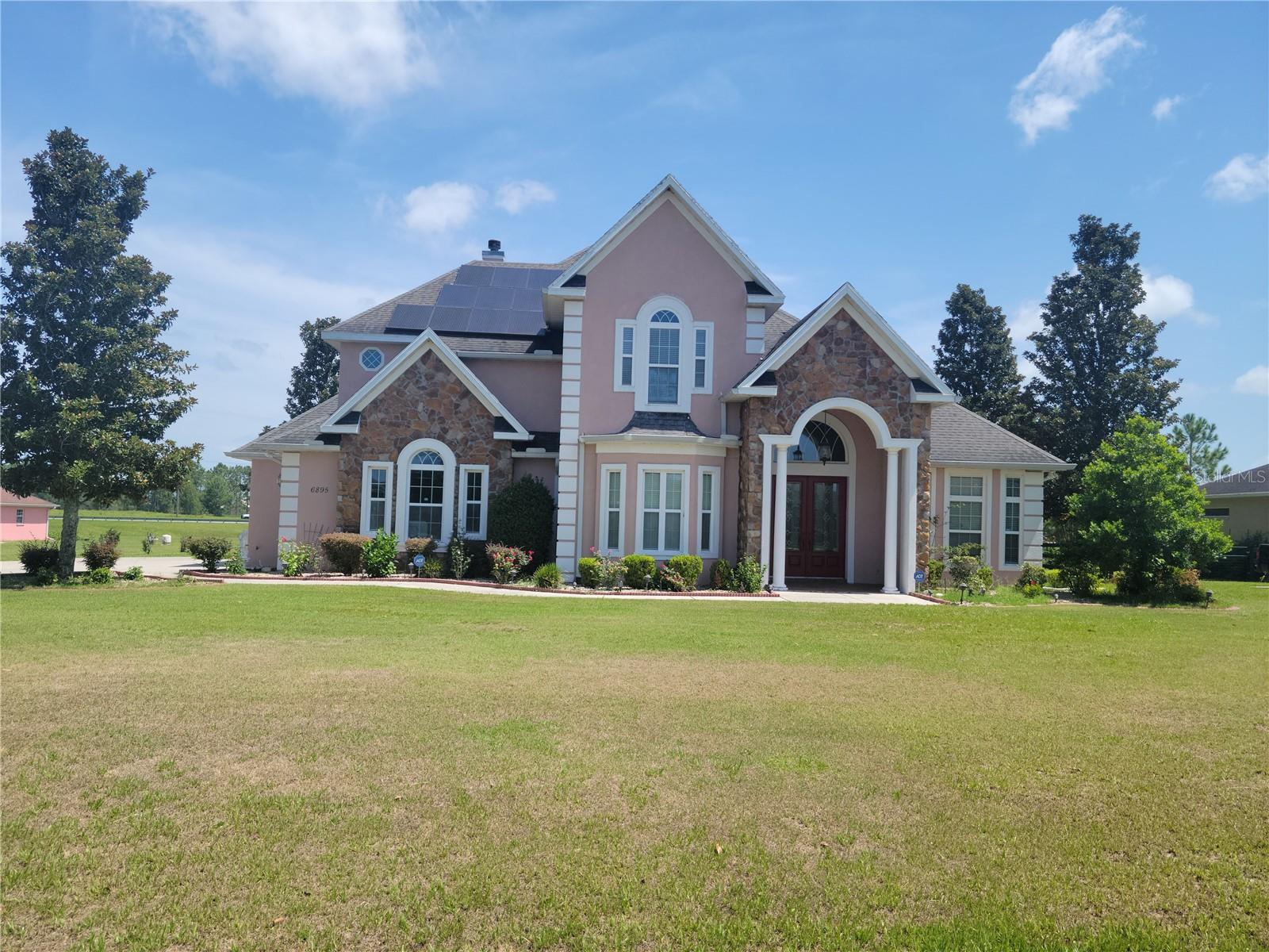 Beautiful custom built 4 bedroom ,4 and a half bath pool home , 3 car garage sits just under an acre with huge entrance and spacious living ,kitchen ,dining ,office ,family room ,fire place ,separate bar and spacious bedrooms with all walking closets.
Home also features beautiful brazilian oaks in entire living area with granite counter top in kitchen with commercial grade stove and oven with ventilation out of home.
Upgraded Chandelier ,solar panel on roof for lower electricity ,pool with hot spa and screening enclosures ,backup generator for electric power outage entire home. Sprinkler system for lawn its through the well. Outdoor cooking area available for any kind of cooking and entertaining.
Laundry chute is available for your convenience . Minutes from all shopping , the villages ,schools ,parks and no neighbors in back. lots of room to play and have fun. Has much more for you to see and make it your future dream home. Selling as is with right to inspect. Seller will help with buyers closing cost. Property also available to rent for $3500 month,1st last and security req.