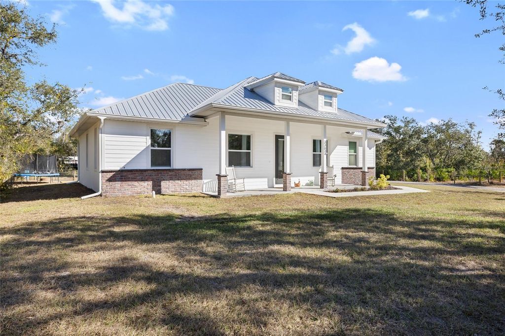 Photo of 33634 Washington Loop Road, Punta Gorda, FL 33982 (MLS # A4678003)