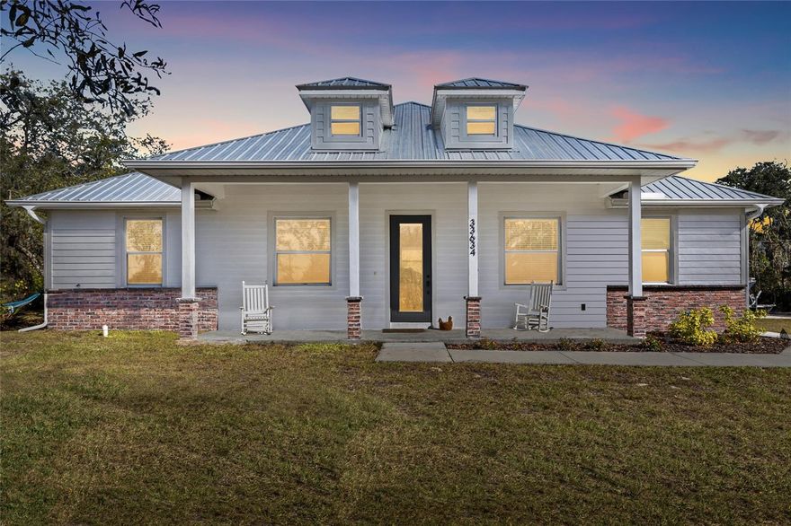 Welcome to your slice of Old Florida living in Punta Gorda! Situated on .92 acres along Washington Loop Rd, this beautifully maintained 3-bedroom, 2-bath home offers the rare freedom of NO HOA and NO CDDs, giving you space, privacy, and flexibility.

Step inside to a bright, open-concept layout with wood-look luxury vinyl flooring throughout, neutral finishes, and abundant natural light. The kitchen is the heart of the home, featuring white cabinetry, granite countertops, a large island with seating, stainless steel appliances, and stylish pendant lighting—perfect for everyday living and entertaining. The living and dining areas flow seamlessly, creating an inviting and functional space.

The primary bedroom is spacious and serene, complete with an en-suite bath, and a clean, modern aesthetic. Both bathrooms showcase granite vanities, black fixtures, and custom tile showers, delivering a fresh, contemporary feel. Secondary bedrooms are well-sized and versatile, ideal for guests, a home office, or hobbies.

Outside, enjoy nearly an acre of open land with room for boats, RVs, toys, gardens, or future additions. The expansive backyard offers endless possibilities, whether you’re envisioning a pool, workshop, or simply enjoying the peaceful setting. A metal roof, charming front porch, and wide driveway add both curb appeal and practicality. Existing RV and shed do not convey.

Conveniently located near downtown Punta Gorda, boating, fishing, shopping, dining, and I-75—this property combines modern comfort with country-style space and freedom.