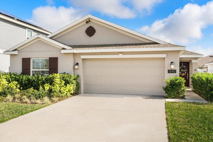 Location, Location, Location! Discover this stunning residence in the highly desirable Trinity Lakes community of Groveland, FL— situated directly across the street from the Resort-Style Amenity Center, including the Clubhouse, Pool, Fitness Center, and Dog Park. Built in 2023, this popular Harrisburg floor plan offers 1,850 square feet of carefully designed living space with 4 bedrooms and 2 full bathrooms, perfectly blending modern style and everyday comfort.
The home welcomes you with impressive exterior upgrades, including new pavers, a new fence, and a beautifully designed, low- maintenance backyard. The outdoor space features open green space, a play area, two mature magnolia trees, and patio lighting that creates a warm, inviting atmosphere—ideal for relaxing, entertaining, or enjoying outdoor living year-round.
Inside, you’ll find stylish finishes and smart functionality throughout. The open-concept kitchen flows seamlessly into the living area, highlighted by a custom built-in entertainment center. A sliding patio door with a motorized, Wi-Fi–capable blind shade enhances both convenience and energy efficiency while connecting indoor and outdoor spaces. Additional features include a first-floor laundry room with washer and dryer, a 2-car garage, solar panels, smart home technology, and energy-efficient systems, offering comfort and long- term savings.
Residents of Trinity Lakes enjoy access to exceptional community amenities, including a resort-style clubhouse, fitness center, playgrounds, and a scenic lakefront park with dock access. Ideally located just 35 minutes from Orlando International Airport and near major highways such as the Florida Turnpike and Highway 50, this home provides easy access to Clermont, Minneola, and Orlando.
Surrounded by top outdoor destinations, including Lake David Park, Green Valley Country Club, Lake Louisa State Park, and Lakeridge Winery, this home delivers the ultimate combination of location, lifestyle, and modern living.
Schedule Your showing today and experience everything Trinity Lakes has to offer.