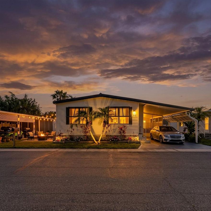 Welcome to 372 Cobia Way — one of the best locations in Gull-Aire Village, sitting directly across from the community pool, spa, and clubhouse! This resident-owned, 55+ golf cart friendly community in the heart of Oldsmar offers the best of Florida retirement living at an unbeatable value.
Step inside to a bright, open floor plan featuring dark hardwood-style flooring and bold coastal teal accents throughout. The spacious living and dining areas flow into a well-appointed kitchen with wood cabinetry, a center island with breakfast bar, and stainless steel appliances. The primary suite includes a private en-suite bath, with a second full bath rounding out the layout. Screened lanai, wide carport, inside laundry, and a utility shed out back — this one has it all.
You own the land. No lot rent. Ever. Low HOA and an active social calendar to boot. Community amenities include a heated pool & spa, clubhouse, sauna, library, shuffleboard, and bocce ball.
Walk across the street to AMC Theatres, Beall's, Marshalls, and a full lineup of restaurants. Minutes to Publix, Walmart, and Countryside Hospital. Just ~10 miles to Honeymoon Island and Caladesi State Park.
NOT in a flood zone!