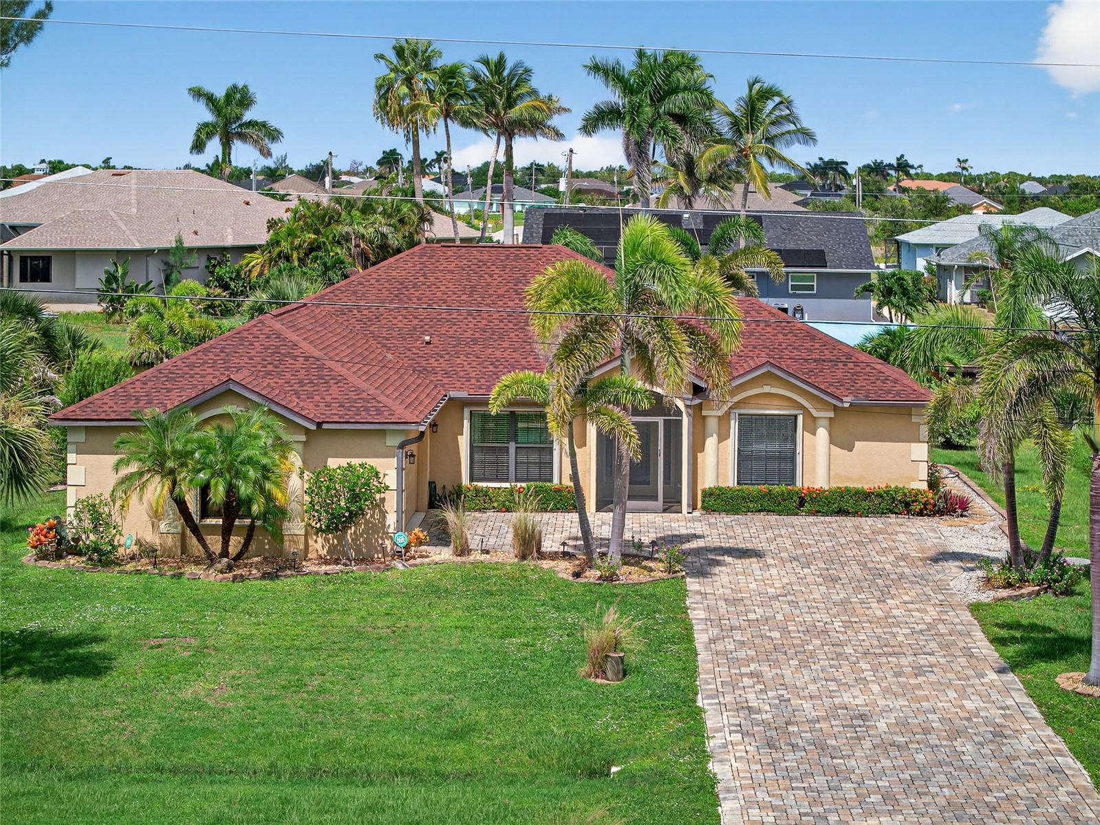 SOUTH GULF COVE! BEAUTIFUL 3 BEDROOM, 2 BATH, 2-CAR GARAGE WATERFRONT POOL HOME WITH 15-MIN. POWERBOAT ACCESS TO MYAKKA RIVER LEADING TO CHARLOTTE HARBOR AND THE GULF! For the avid boater, 80’ of waterfrontage offers extended dock with water and electric plus covered boat lift. Step inside to an open floor plan featuring volume ceilings, neutral décor, living room with pocket slider to lanai and tile flooring throughout. Well-equipped kitchen offers granite counters, wood cabinetry, stainless appliances, breakfast bar and eat-in area overlooking water views. Generous primary suite highlights tray ceiling, French doors to lanai and private bath with dual sinks and walk in shower. Both guest bedrooms feature walk-in closets and share access to full pool bath. Outdoor entertaining area features covered lanai with sunshades, kitchenette, convenient outside bath access, screened heated saltwater pool and above ground spa. True western exposure to enjoy amazing sunsets while relaxing by the pool or at the dock sitting area. Special features include new roof, a/c and boat canopy in 2023, accordion hurricane shutters, paver drive, walkway and pool deck, side load garage and mature tropical landscaping. Fabulous location minutes from Interceptor Lagoon where minimal wake ends and a short drive to many gulf beaches. Close to restaurants, shopping, schools and numerous golf courses. Don’t miss this opportunity! Schedule your private showing today!