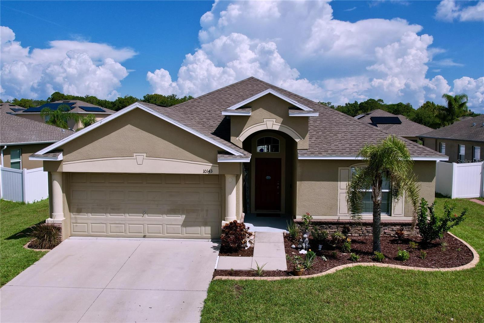 Welcome to this stunning 2017 The Normandy Model in the sought-after Briar Oaks community! This spacious 4-bedroom, 3-bath home offers a thoughtfully designed open floor plan perfect for modern living. The upgraded kitchen features beautiful 3cm Santa Cecilia dark granite countertops with a half bullnose edge, a 5-inch backsplash, stainless steel undermount double sink, and a convenient pull-out sprayer faucet. Enjoy casual meals at the large breakfast bar or host gatherings in the separate formal dining area. The expansive great room boasts soaring ceilings, making it a perfect space to relax or entertain. The primary suite offers a walk-in closet and a luxurious ensuite bath with dual sinks, a garden tub, and a separate shower. Three additional bedrooms are smartly positioned for privacy, including a front-facing 4th bedroom ideal for guests or a home office. Ideal for siblings or shared living, a Jack and Jill bathroom sits between two bedrooms, creating a smart and practical layout. Step outside to enjoy both front and rear covered lanais, perfect for year-round Florida living. Additional builder upgrades include stone veneer accents, a garage door opener, and energy-efficient features like a hybrid water heater and insulated windows. Recent updates include stylish waterproof vinyl flooring and concrete landscape curbing in the front yard. Located in a peaceful setting yet close to Tampa Bay beaches, golf courses, shopping, and dining. Briar Oaks offers fantastic community amenities including a playground, dog park, sidewalks, and street lighting—all with a low HOA fee. This home combines style, comfort, and convenience—schedule your showing today!