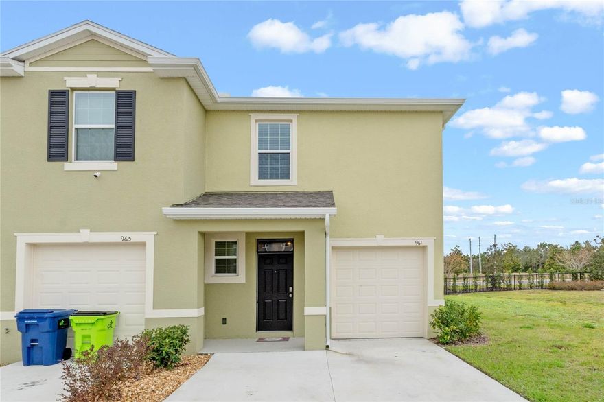 A stunning two-story townhome floor plan within the Venezia community in Howey-in-the-Hills, Florida. FHA ASSUMABLE LOAN AT 4.9%. This modern and stylish residence offers three spacious bedrooms, two and a half beautifully designed bathrooms, and a one car garage, making it the perfect blend of comfort and practicality. With 1,758 square feet of all-concrete block construction, this home is built to impress. As you step inside, you'll be greeted by sleek, contemporary design elements and high-end finishes throughout. The expansive kitchen features a large island, a cozy breakfast nook, and a generously sized walk-in pantry, making meal prep and entertaining effortless. The open-concept living area is perfect for both relaxation and hosting guests, with a kitchen outfitted with stainless-steel appliances, quartz countertops, and plenty of cabinet space. The foyer leads to a convenient powder room and opens up into the spacious family room, which flows out to a covered rear lanai—ideal for dining or simply enjoying the Florida sunshine. Upstairs, the primary bedroom offers a peaceful retreat with an ensuite bath complete with dual sinks and a separate walk-in shower. Two additional bedrooms provide flexibility for guests, a home office, or hobbies, while the practical laundry room simplifies everyday tasks. Designed with modern living in mind, this townhome comes equipped with integrated smart home technology, allowing you to easily control lighting, temperature, security, and more. Featuring energy-efficient elements and premium amenities, The Vale offers an urban lifestyle in a peaceful, sought-after location. Located close to major highways, schools, shopping and restaurants.