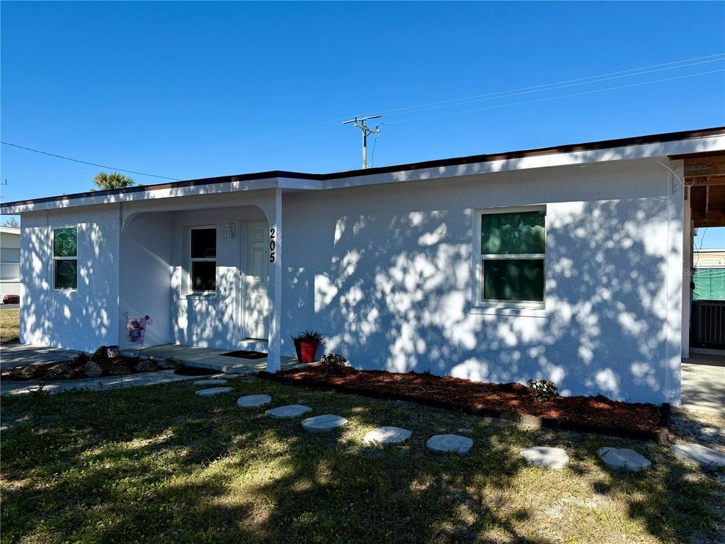 Photo of 205 NE Martin Drive NE, Port Charlotte, FL 33952 (MLS # A4666719)