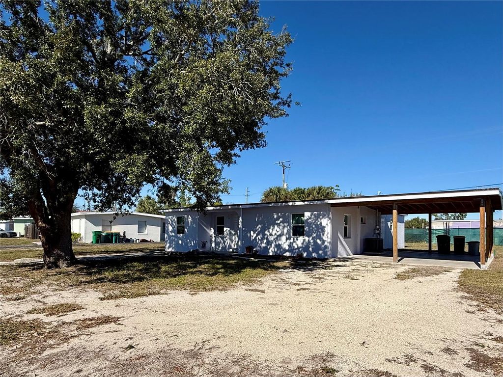 Photo of 205 NE Martin Drive NE, Port Charlotte, FL 33952 (MLS # A4666719)