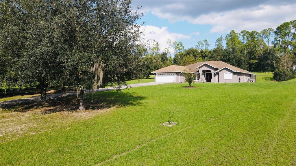 Photo of 8750 Teacher Lane, Zephyrhills, FL 33541 (MLS # TB8558275)