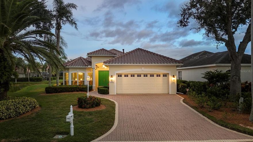 Surrounded by beauty on both sides, this stunning three-bedroom, three-bath residence is positioned on one of the most remarkable lots in all of University Park Country Club—offering expansive, unobstructed views of the lake and golf course. Near a quiet cul-de-sac within this prestigious gated community, the home captivates from the moment you arrive with its timeless architectural detail, nearly 3,000 square feet of elegant living space, custom window treatments, designer lighting and numerous recent updates including a new roof, new gutters and new panoramic lanai screen, all completed in September 2025 with transferable warranties. Through the custom new French Provincial-style double entry doors, you’re greeted by soaring ceilings, abundant natural light, and an open layout that flows effortlessly for entertaining and everyday living. The formal living and dining rooms feature a space to entertain, refined crown molding and architectural details that enhance the home’s sophisticated design. The inviting great room offers custom built-ins, a gas fireplace, designer lighting, and walls of sliding glass doors that open to the lanai—framing postcard-perfect views of the glistening lake and manicured fairways beyond. The chef’s kitchen is equally impressive, showcasing custom cabinetry, a center island, stone countertops, tile backsplash, stainless steel appliances and a cozy breakfast nook where every meal is accompanied by a spectacular view. The oversized primary suite is a serene retreat with over 10 feet of picture windows capturing the panoramic golf course vistas. A tray ceiling, dual walk-in closets, and a spa-inspired bath with dual vanities, soaking tub, walk-in shower and sparkling chandelier complete this luxurious space. Two additional bedrooms ensure comfort and privacy for guests. Go outside to your private oasis, an expansive screened lanai featuring a new panoramic screen designed to showcase the breathtaking, uninterrupted views. Enjoy multiple spaces for outdoor living, including a covered entertaining area, a relaxing sunbathing terrace, an outdoor kitchen, and a sparkling pool and spa accented by a custom dolphin fountain. As the sun dips below the horizon, the sky ignites in brilliant color, its reflection dancing across the lake and fairway for a magical view. Offered fully furnished, this home is move-in ready making it easy to simply come home and embrace the best of Florida living. Within the award-winning University Park Country Club, residents enjoy 27 holes of championship golf, tennis, pickleball, fitness, and fine dining as well as access to a lovely community lap swimming pool in the Notting Hill section of the neighborhood, and all just minutes from world-class shopping at UTC, downtown Sarasota’s cultural attractions and pristine Gulf beaches.