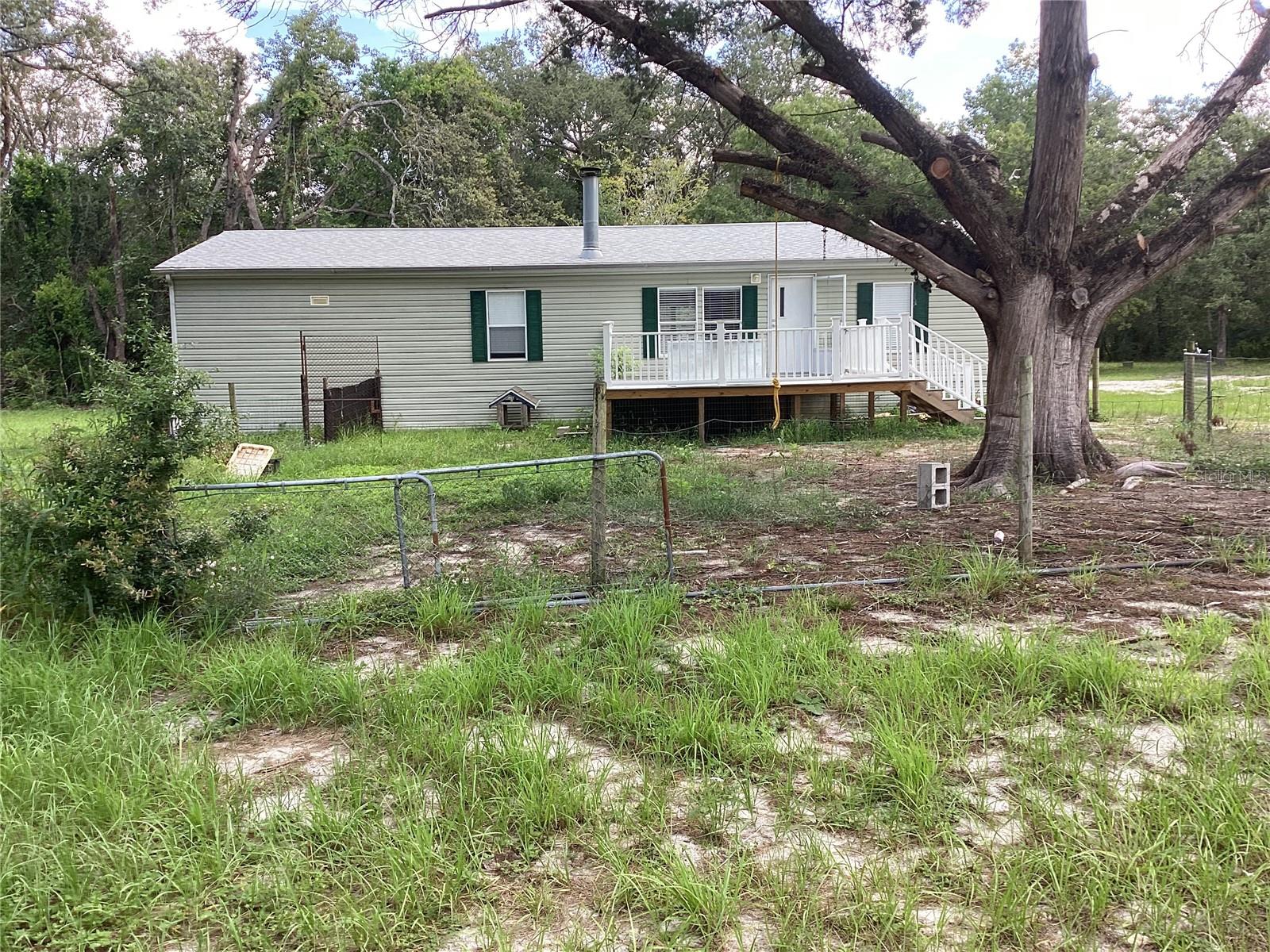 Welcome to 16401 and 16411 Tiger Trail 3.8 acre lot in beautiful Spring Hill, Florida! This stunning property offers a perfect blend of luxury, comfort, privacy and tranquility, making it the ideal place to call home. 3.8 acres allows for horses or other animals.
This property contains 2 modular homes. The first is a 2006 1560 sq foot. 3 BR, 2BA. This home is finishing a complete inside renovation including new counter tops in kitchen, luxury vinyl plank flooring, new master bath and 2nd bath. 2023 new HVAC and roof. 2nd home is a 1986, 960 sq. FT, 2BR, 2BA that needs a complete inside renovation. The property is located in a peaceful neighborhood, offering a serene and private setting for you to enjoy. Each home has a separate street address and separate utilities that make it perfect to rent one out and live in the other or rent both out.
Step inside this meticulously maintained home and you will be impressed by the attention to detail and quality craftsmanship throughout. The interior features an open and spacious floor plan, with plenty of natural light streaming in through the large windows. The living room is inviting and cozy, perfect for relaxing with family and friends.
The master suite is a true retreat, offering a peaceful oasis to unwind at the end of the day. The ensuite bathroom is luxurious, featuring a spa-like soaking tub, a separate shower, and 2 sinks.
More photos to follow as our renovation is being completed next 2 weeks.