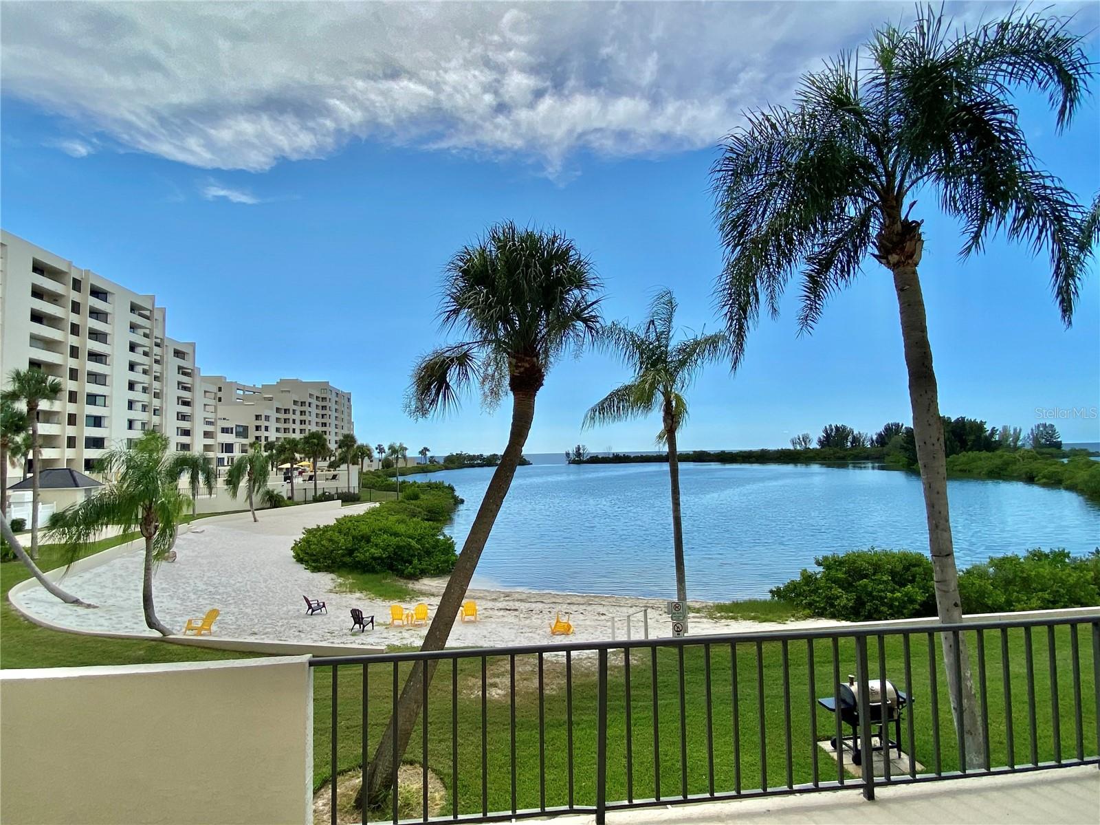 "RARE OPPORTUNITY" to live in this Resort Style GULF OF AMERICA front community in huge 3 bedroom / 2 bath condominium. This condo just received major updating with new expanded kitchen , paint, flooring, lighting and bathroom improvements. The main living area has been opened up and now features water views from the dining area through the kitchen and living room to the glassed in florida room. The bright brand new kitchen boasts self closing cabinets and draws, glassed door upper cabinets and gorgeous granite counters, farmstyle drop in sink, and stainlees steel appliances. Living room and dining area are accented with tongue and groove walls. Totally furnished and equipped with brand new appliances , furniture, and contents. Just bring your suitcase. The condo has an assigned covered parking space . The almost 1600 sq ft of living space features 2 slding glass doors from the living room and master suite to the unique glassed in 20 ft Florida room overlooking the private sandy beach with beautiful water and summer sunset views. Watch the dolphins fish, the manatee float,birds soar by, turtles, and rays. Nature surround this island paradise. The other wing of the condo features 2 full bedrooms and a bath each with sliding glass doors onto a balcony overlooking the Marina and morning sun rises. The master suite boasts a newer tiled shower and all the bedrooms feature mirrored sliding closet doors. Beautiful Gulfside pool , sandy beach, and nature trail for your enjoyment. All this surrounded by water and only accessable through the 24/7 security guarded gate for your upmost security. Community conviently located near multiple restaurants, golf courses, beaches & parks, and all that the Tampa Bay and St Pete/Clearwater areas have to offer day or night. Come and enjoy the good life a little. Don't you deserve it? All utilities included except electricity.The rental rate will vary depending on the length of stay and time of year!