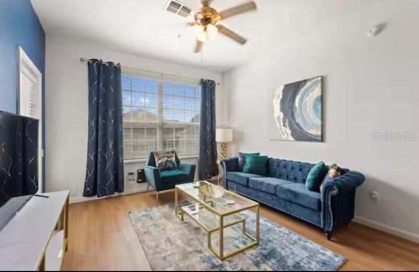 Photo of 8103 Coconut Palm Way #302, Kissimmee, FL 34747 (MLS # O6426401)