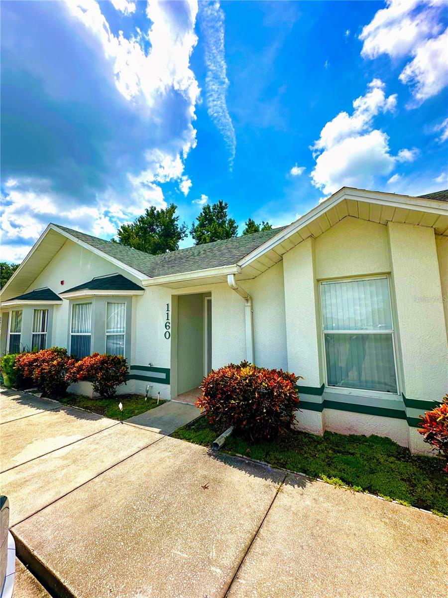 Enjoy the serenity of the waterview from this spacious 3 bedroom 2 bath townhome in the desirable gated neighborhood of Jade East located just off Fortune Road in Kissimmee providing the perfect blend of comfort, convenience and picturesque scenery This beautifully maintained villa offers a tranquil retreat with picturesque pond views, ideal for both relaxation and entertaining. The open-concept layout features a great room with vaulted ceilings, creating an airy and inviting atmosphere and a well-appointed kitchen including a breakfast bar. The primary bedroom offers a walk-in closet and an en-suite bathroom. Step through sliding glass doors onto the screened-in back porch, where you can enjoy shaded comfort overlooking a serene pond, offering peaceful water views. Take advantage of the community pool and clubhouse, perfect for relaxation and social gatherings. Located minutes from major highways including the Florida Turnpike, Osceola Parkway, and State Road 417 making for an easy commute to the Orlando Airport and major theme parks. Close to shopping, dining, recreational areas and entertainment venues