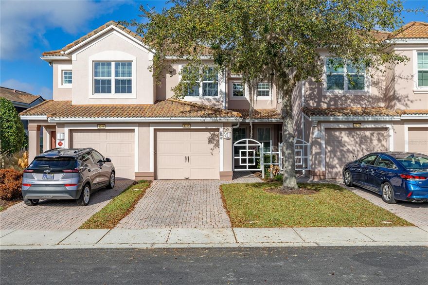 Located within the highly sought-after gated community of Bella Trae, in the desirable Promenades enclave, this immaculately maintained, show-home-presented first-floor condominium offers spacious and flexible living in the heart of ChampionsGate. The property also benefits from an attached one-car garage, private driveway, and peaceful water views, making it a rare and highly appealing offering within the community.

Perfectly positioned just minutes from Central Florida’s world-famous theme parks, the tourist corridor, shopping, dining, and major highways, the location offers an ideal blend of convenience and tranquility.

Inside, the home features two generously sized bedrooms plus a versatile bonus room, which can easily serve as a third bedroom, home office, or additional living space depending on your needs.

The thoughtfully designed floor plan connects the living and dining areas, creating an open and welcoming atmosphere that flows effortlessly onto a spacious screened lanai overlooking a tranquil pond—the perfect place to relax and enjoy the calming water views.

The galley-style kitchen is fitted with stainless steel appliances and includes a charming breakfast nook surrounded by three beautifully positioned windows, allowing natural light to fill the space while framing relaxing views of the water.

The primary suite is privately positioned away from the additional rooms, offering a quiet and comfortable space to unwind. The suite features a large walk-in closet, an expansive vanity with dual sinks, and a spacious walk-in shower.  Washer and Dryer are included.

Residents of Bella Trae enjoy a maintenance-free lifestyle, with HOA fees covering exterior maintenance, cable and internet service, pest control, and access to exceptional community amenities. The impressive clubhouse features a resort-style pool and spa, fitness center, billiards room, library, meeting spaces, outdoor grilling areas, tennis courts, and a putting green.

Currently leased to long-term tenants, this property presents an excellent opportunity as an investment property or future primary or vacation residence.

With its immaculate presentation, peaceful water views, and prime location near Central Florida’s major attractions, this home offers the very best of Bella Trae living.