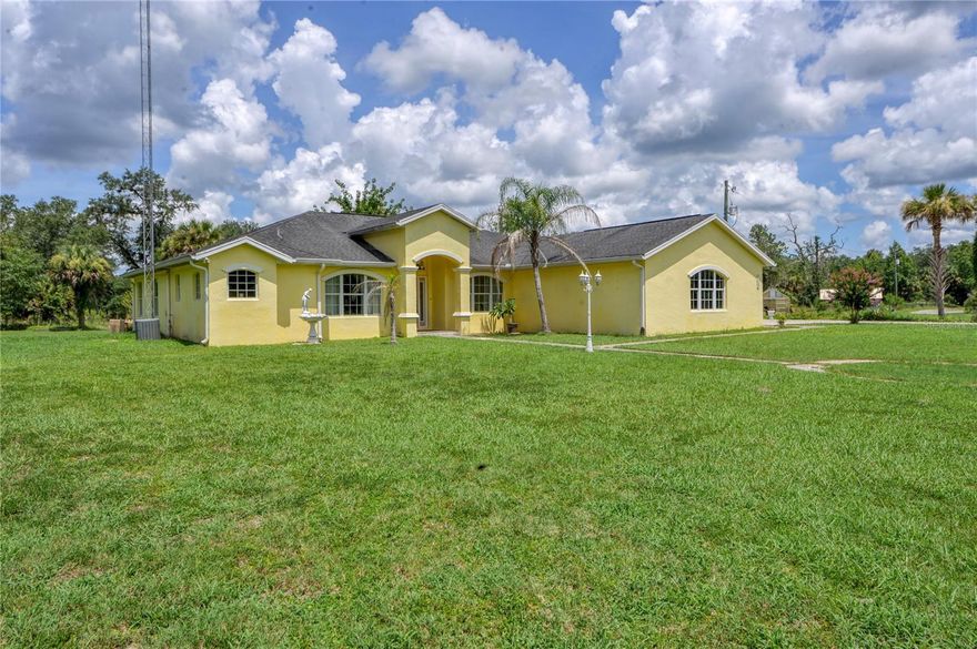 Rare find...and a great alternative if you are looking for a 20+ acre farm in Ocala under a million w/fiber optic internet. Minutes to Ocala, 30 min to World Equestrian Center, 35 minutes to Florida horse park. Horse /hiking trails close to property. A stately gated entrance with a long palm tree lined drive that sweeps around a pond with waterfall upon approach to the home. This well built CBS construction with solid oak wood floors and a FULL basement (a rare find in Florida). It is centrally located, close to town (Ocala)15 min and 5 min to Ocala forest for nature lovers, hiking, riding, fishing and ATV's. You have Silver Springs 10 minutes away for kayaking and seeing the manatees. Tastefully decorated so you can move right in...this home has lovely light, fabulous split floor plan and plenty of upgrades, solid wood oak floors, large kitchen w/granite counters, center island and newer appliances 2019, and a lovely open air lanai. The home also has a newer HVAC 2021 and a propane generator. There is a full basement with high ceilings, and partially finished approx 800 sq ft featuring craft room and/or bedroom, full bath and plenty of storage. This property includes parcel 16321-009-00 12.25 acres with 3/2 mobile home that rents on approx a 1/2 acre for $700 monthly, tenant would like to stay and parcel 16231-008-00 10.95 acres that has the main CBS 2581 sq ft home plus a full basement which is partially finished providing approx an additional 800 sq ft. There is also plenty of room approx 1500 sq ft for a workshop with exterior entrance and still room for the ultimate man cave. A pole barn with steel beams that could easily allow for 4-6 stalls with room to spare for tack and feed room, 1/2 bath or would make a great car barn with the 2 large doors on either end. There is a loft that could potentially be converted to extra living space or could make a perfect art studio with views out to the pond. There is another barn that could accommodate other animals as well. With a little bit of work to the barns and mowing the pastures this property would be spectacular again. Well priced for 2 parcels totaling 23+ acres with 2 homes and out buildings.