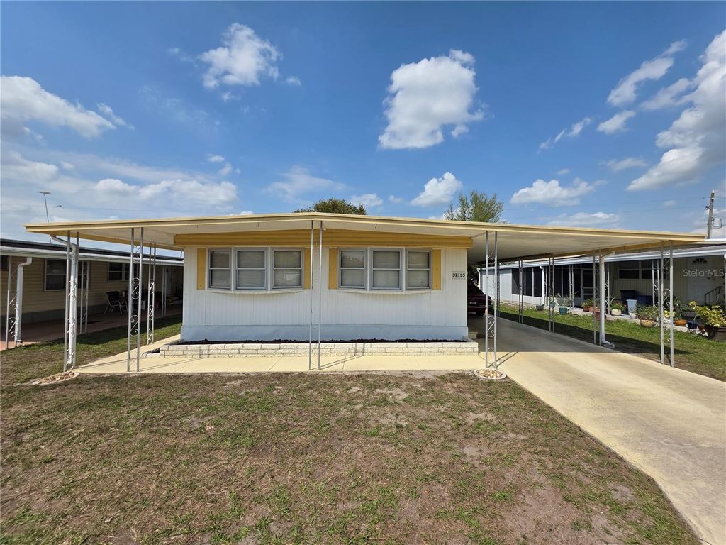 Photo of 37135 Sandra Avenue, Zephyrhills, FL 33542 (MLS # TB8491407)