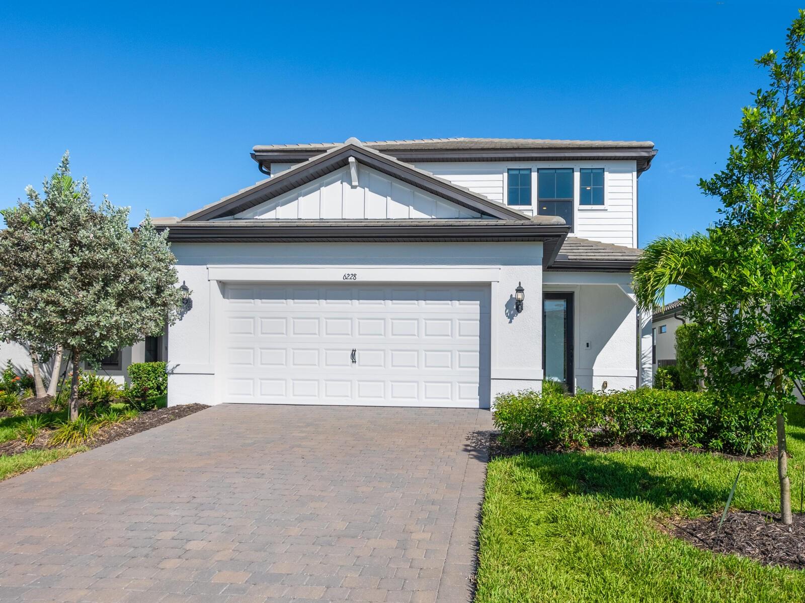 Turn-Key Home in Sapphire Point at Lakewood Ranch
Welcome to 6228 Baywood Court, an exceptional opportunity to own a fully turn-key, move-in ready residence in the exclusive gated community of Sapphire Point at Lakewood Ranch. Built in 2023, this beautifully maintained Morris floorplan offers 4 bedrooms, 3 bathrooms, and 2,207 square feet of thoughtfully designed living space—blending comfort, style, and functionality.
Set on a quiet street with partial water views, the home boasts striking curb appeal with a paver driveway and professionally landscaped exterior. Inside, you’ll find an open-concept layout filled with natural light, highlighted by luxury vinyl plank flooring, custom window shades, and a spacious gathering room with 9-foot ceilings and sliding glass doors that invite indoor-outdoor living.
The gourmet kitchen is a chef’s dream, featuring soft-close cabinetry, a subway tile backsplash, quartz countertops, a large island, and Whirlpool stainless steel appliances. A private first-floor guest suite with full bath is ideal for visitors or multigenerational living.
Upstairs, the elegant primary suite offers a spa-inspired retreat with a frameless glass walk-in shower, and a generous walk-in closet. Two additional guest bedrooms—each with queen beds—share a well-appointed full bath with a tub/shower combination. A second-floor laundry room, two-car garage, and screened paver lanai with grill and lounge area complete the home’s impressive offerings.
As a resident of Sapphire Point, enjoy resort-style amenities including a clubhouse with catering kitchen, state-of-the-art fitness center, beach-entry pool, sports court, dog park, playground, fire pit, and covered pavilion—creating a vibrant and welcoming community for all ages.
Situated near the Premier Sports Campus and just minutes from top-rated schools, upscale shopping, dining, and the best of Lakewood Ranch, this home offers the perfect blend of luxury, convenience, and lifestyle.
Don’t miss your chance to own this turnkey furnished home in one of Southwest Florida’s most sought-after master-planned communities. Schedule your private showing today!