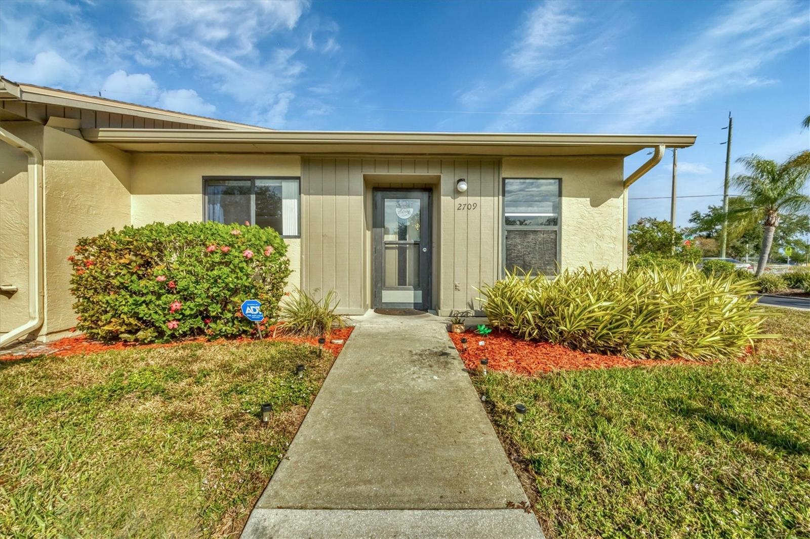 Welcome to your Florida oasis! This two-bedroom, two-bath, corner-unit condominium has plenty of natural light and has been updated to suit your needs. Its features include a fully remodeled kitchen, quartz countertops, stainless appliances, laminate flooring, updated guest bathroom vanity, custom built-in cabinetry in the primary suite, new light fixtures, new privacy blinds and a designated laundry room. Rest easy knowing that this home has a new roof and new AC, maintenance included lawn care, community pool, designated carport and so much more. Furnishings optional. Book your appointment to see it today!