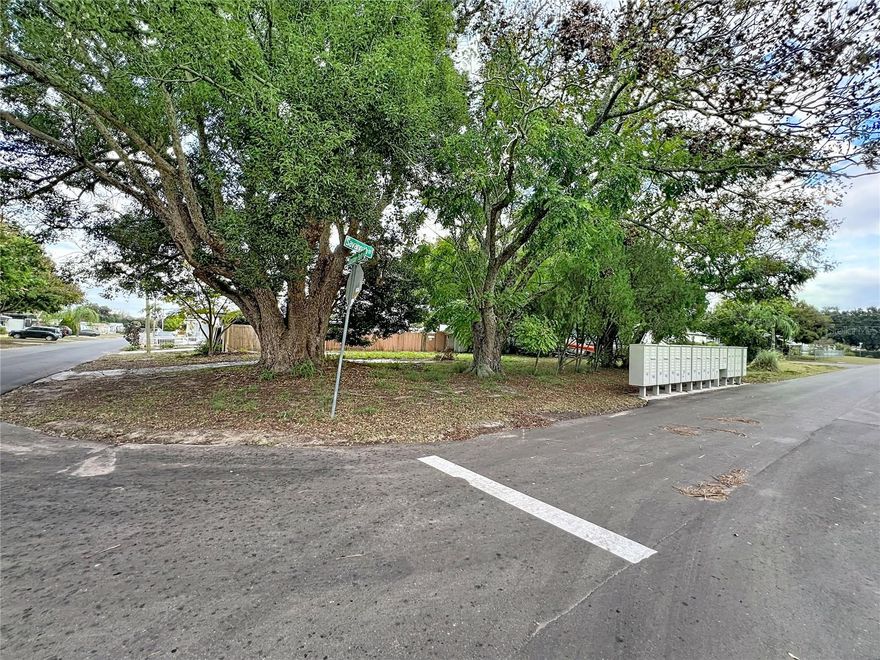 Vacant corner lot in an established manufactured home community. The previous mobile home has been removed, creating a clean slate for your new manufactured home. Measuring approximately 65 x 81, this north-facing parcel offers a functional layout with mature trees at the front and side that provide natural shade, privacy, and curb appeal. Situated in a residential area with convenient access to public transit, parks, shopping, and everyday amenities. A great opportunity to place a new home in a neighborhood where properties are already well established. Bring your plans and make it your own.