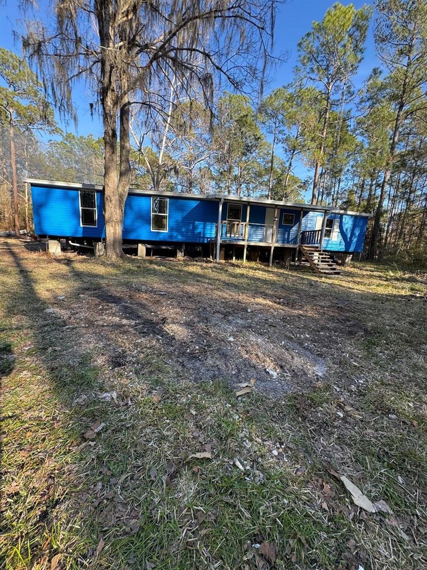 Opportunity awaits in peaceful Citra, FL in beautiful Marion County!

Situated on over an acre of land, this property offers the perfect setting for those craving space, privacy, and the freedom of country living. The mobile home has already had the exterior walls installed, providing a solid start to your vision, while the interior remains ready for completion—allowing you to design and finish the home exactly the way you want. Even better, the current owners have left the materials on-site, giving you a head start on bringing this project to life.

Equipped with well water and a septic system, this property offers rural convenience without HOA restrictions—ideal for outdoor enthusiasts, hobby farmers, or anyone looking for room to roam.

Nature lovers will appreciate the location, surrounded by nearby stables, campgrounds, and riding trails, and just minutes from Indian Lake State Forest Campground. Enjoy easy access to outdoor adventures at Salt Springs, and the convenience of being a short drive to Ocala and Fort McCoy.

Whether you're looking for an investment opportunity, a weekend retreat, or the chance to create your own country escape, this property offers endless potential in a serene North Central Florida setting.