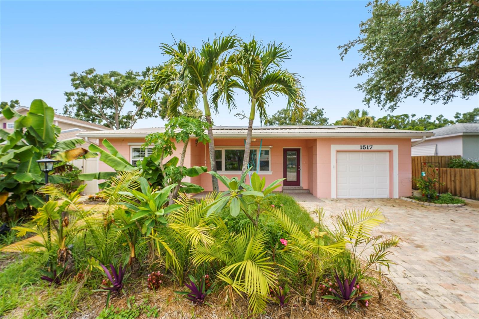 Hello and welcome to Gulfport!
This amazing home boasts over 2,000 square feet of beautiful bamboo flooring throughout. The expanded kitchen features modern ceiling fans.
The spacious dining area opens through French doors to a den with a cozy fireplace. To the left, you'll find a bedroom, while the master suite is located to the right. The master bathroom is a true highlight, featuring a charming clawfoot tub and a large walk-in shower. The walk-in closet is another impressive space with custom built-ins.
Step outside to the partially covered and fully screened-in pool deck, an oasis perfect for relaxation.