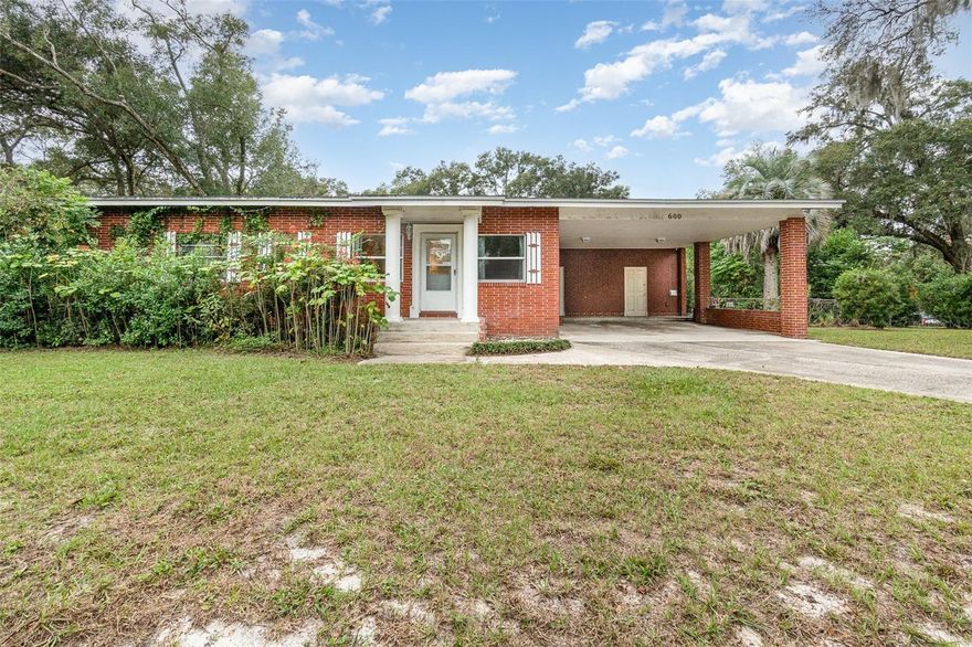This property is a gem, situated in the historic and highly sought-after Stetson Highlands of Deland, offering almost an acre of land that could be subdivided or used for a second home. Just off W. New York Ave and being close to downtown Deland means easy access to shopping, dining, medical facilities and entertainment—a big plus! This house has had all the major updates taken care of, like a newer roof, rewired electric, re-piped plumbing, newer toilets, a refurbished HVAC, and a large hybrid water heater—all fantastic for peace of mind. The backyard sounds like a dream with a gazebo and fire pit, a plethora of fruit trees, a pool, and a hot tub—perfect for both summer and winter relaxation. The interior boasts conveniences like an oversized laundry room with additional storage, a wood-burning and electric fireplace in your family room, a real wood accent wall in your living room, cedar closets and an enclosed workshop just off the 2 car carport. Efficiency is a priority with a solar-powered attic fan and double-pane windows in much of the house. This property has so much to offer, from its practical updates to its charming features, it is an ideal place to call your next home!