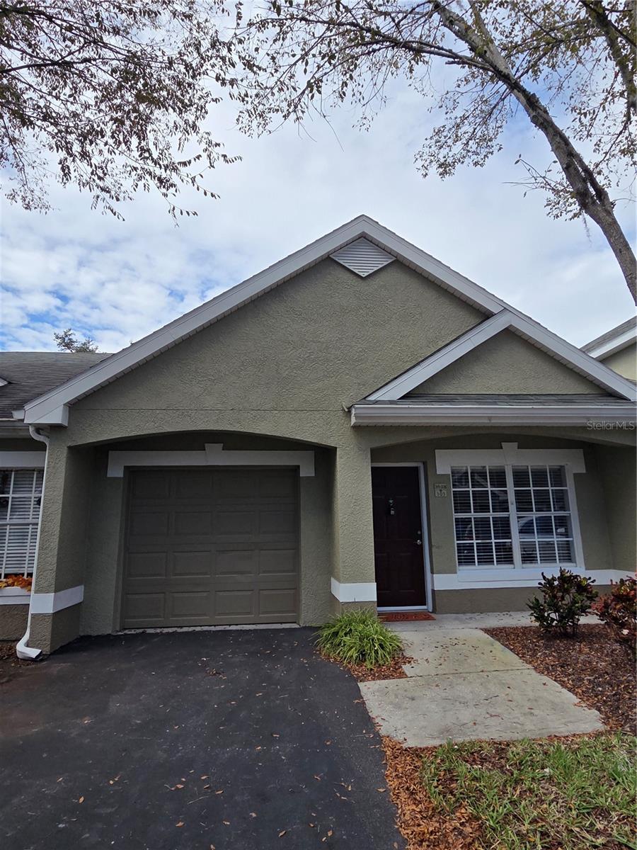 REOVATED, CLEAN AND READY to move in with attention to all the details taken care of. New bathroom vanities, new mirrors, new lighting, new plumbing fixtures including toilets. Beautifully painted in Arctic light blue shade gives this condo a fresh and calming appearance. Make this your next home while living on the green space nearby the pool that you can walk to from your enclosed, screened patio with its gorgeous new tile floor.
Entire condo is a light shade of grey luxury vinyl plank flooring, Easy to maintain and great to decorate with. The entire garage has been painted semi-gloss with a light grey painted floor. Private mailbox kiosk on site, gated community, pet friendly w baggie stations, sidewalks to enjoy strolls all with a comfortable environment of safety experienced in Waterford Condominiums where every home owner has a garage.. Privately owned properties. Walking distance to Publix, restaurants, shops and services and the Pinellas Trail, as well as John Chesnut Park for your enjoyment. Sought after school area. Easy drive to Tampa International Airport and Clearwater St Pete Airport...both are within 20 to 30 minutes away. MAKE AN APPT TO VIEW THIS LOVELY CONDO AND MAKE IT YOUR NEXT HOME.