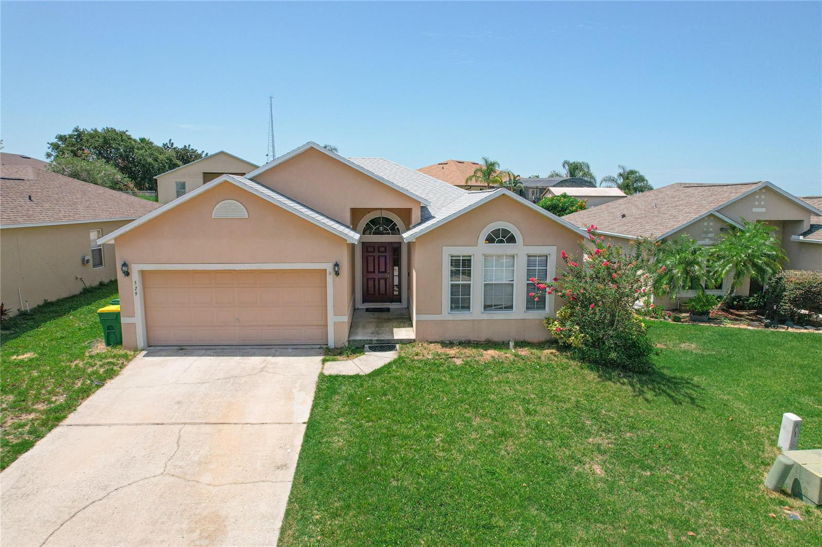 Welcome to 529 Ridges Dr in Dundee, FL! This home has a solid foundation for those seeking a practical residence. The roof was replaced in 2023, providing peace of mind for years to come. Inside, you’ll find a functional layout with wood flooring in the main living areas, carpet in the bedrooms, and the master bedroom ready for your finishing touch with exposed concrete. The kitchen is equipped with a refrigerator, stove, and microwave, and the home also includes a dedicated laundry room for added convenience. Cooling is provided by a window unit. This property has great potential at an affordable price point and the chance to make it truly your own