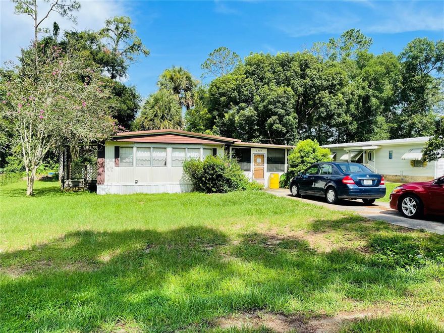 Priced to Sell Fixer Upper. Great opportunity to own a home on .24 acres. LAND is owned Not Leased. Come and put your personal touches to this 2/1.5 home. Abundance of natural light thru-out the home and covered enclosed patio with many windows for your summer barbecues or breezy mornings. 2 separate entrances to this home, the main entrance and the patio entrance. Spacious lot for growing your vegetable/fruit gardens. Mature trees give you a nice lush landscape setting. Separate storage shed/workshop with light on property. Well established neighborhood close to Parks and Recreation areas.