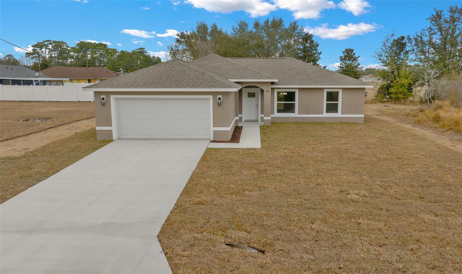 Photos Are of a Similar Model. Don’t miss this opportunity to own a brand-new, beautifully designed residence in the highly desirable Southeast Ocala/Silver Springs Shores area. Located at 31 Juniper Dr on a .23-acre homesite, this home delivers quality craftsmanship, thoughtful design, and modern comfort.
This well-appointed 3 bedroom, 2 bathroom property features a spacious open-concept floor plan perfect for both everyday living and entertaining. Large windows and neutral finishes create a bright, airy atmosphere. Durable luxury vinyl plank flooring enhances the main living spaces with the look of hardwood and the ease of low-maintenance living.
At the heart of the home is the gourmet kitchen, complete with granite countertops, custom cabinetry, a center island with bar seating, and seamless flow into the dining and living areas—ideal for family gatherings or casual entertaining.
The private owner’s suite provides a peaceful retreat, showcasing a spa-inspired en-suite bathroom with dual vanities, a tiled walk-in shower, and a large walk-in closet. Two additional bedrooms share a beautifully appointed second bathroom, offering flexibility for family, guests, or a home office.
Step outside to enjoy your own outdoor space—perfect for relaxing or entertaining. The covered rear porch is the ideal spot to enjoy your morning coffee or unwind in the evenings overlooking your backyard.
Additional highlights include:
Energy-efficient new construction
Spacious 2-car garage
Inside laundry room
No HOA fees
This home combines privacy and convenience, located close to schools, shopping, dining, medical facilities, and major highways for easy access to all that Ocala and Central Florida have to offer.
Whether you are a first-time buyer, investor, or looking to downsize without sacrificing quality, this home represents exceptional value in a prime location. New construction opportunities in this sought-after neighborhood are rare—schedule your showing today.