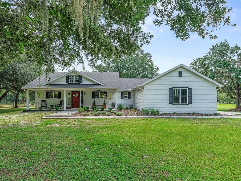 Photo of 1539 SE 34th Way, Summerville, FL 33585 (MLS # OM729236)