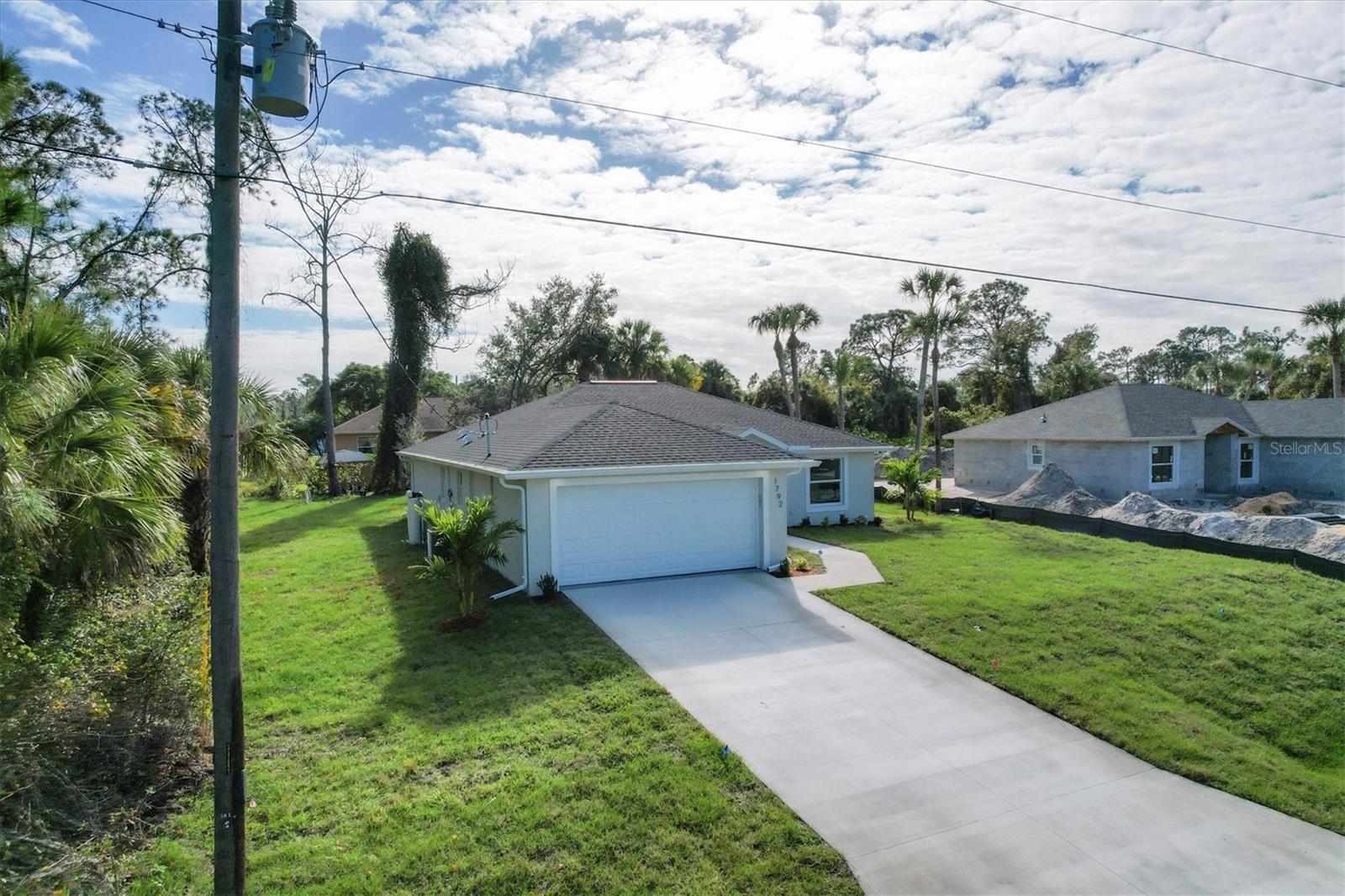 Introducing the Isabella – a beautifully crafted 4-bedroom, 2-bathroom new construction home located on a spacious ¼-acre lot in the thriving city of North Port, Florida.
This thoughtfully designed residence features a modern open-concept layout perfect for families, entertaining, or long-term investment. The entire home is finished with high-end porcelain tile throughout — no carpet — offering a sleek, uniform, and low-maintenance surface in every room.
Built with quality and durability in mind, the Isabella includes impact-resistant hurricane windows, providing added safety, energy efficiency, and peace of mind. The modern kitchen is equipped with quartz countertops, contemporary cabinetry, and a smart layout that flows effortlessly into the living and dining areas. Both bathrooms reflect the same clean, stylish design, with quartz vanities and designer finishes.
Additional features include a spacious two-car garage, a covered lanai for outdoor living, and a generous backyard with room for a pool, garden, or outdoor entertaining. The ¼-acre lot provides extra privacy and plenty of room to grow.
This home is built by a trusted local builder and comes with a 1-year builder’s warranty and a 10-year structural warranty, ensuring peace of mind for years to come.
Please note: Photos may be from a finished model home and are intended to show quality and finishes. Actual home may vary slightly in layout or design.
Located near I-75, shopping, dining, top-rated schools, and Florida’s renowned Gulf beaches, the Isabella offers the perfect blend of comfort, style, and convenience.