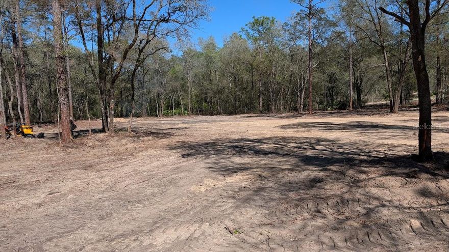 One of the few paved road lots listed in Rolling Hills.  Recently cleared building site and left the corner wooded.  No HOA, zoned for houses only, no mobile homes.  Build your house with your builder, then you can have your barn and toys.  Nice new house on adjoining lot.  Close to shopping and half way between Ocala and Dunnellon.