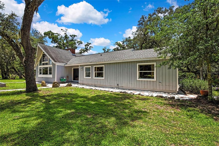 SELLER MOTIVATED!!Today's savings are tomorrow's Equity! Private Gated Estate on Nearly 23 Acres | Ranch-Style Home | Guest Studio | Barn | Stocked Pond
A True Country Retreat with Endless Possibilities!
Welcome to your dream estate! Nestled on 22.98 acres of serene countryside, this extraordinary property offers the ultimate in privacy, peace, and potential. Enter through a distinguished brick and wrought-iron gated entrance and travel along 800 feet of paved driveway, enhanced by an additional 200-foot circular drive lit by a charming street lamp—guiding you home beneath a canopy of majestic oaks.
At the heart of the estate lies a handsome A-frame ranch-style home featuring classic cedar lap siding and a well-thought-out split-level design for privacy and comfort. The home sits on 8 cleared acres and showcases tranquil views of nature and a stocked pond. Inside, you’ll find 3 bedrooms, 2 bathrooms, a spacious loft, and two cozy brick wood-burning fireplaces—one in the living room with soaring vaulted ceilings and yellow pine paneling, and one in the private master suite.
The inviting foyer welcomes you with striking Pecky Cypress walls, while the kitchen features a breakfast nook, gas range, electric oven, and easy-to-maintain Formica counters. The master bedroom includes its own entrance, fireplace, French doors to the backyard, a private bath, and stacked washer/dryer. The second bedroom offers another washer/dryer hookup, and the third bedroom opens to the outdoors via sliding glass doors leading to a 16' x 40' screened wood deck—perfect for enjoying the sounds of your very own wildlife sanctuary.
This stunning estate is home to wild turkeys, black-bellied whistling ducks, deer, and even the occasional bobcat family. The pond is stocked with tilapia for your private fishing pleasure.
But that’s not all—this property offers impressive outbuildings to support your hobbies, guests, or business ventures:
• A 20’ x 24’ detached 2-car garage/workshop with washer/dryer hookup and water heater.
• A 30’ x 30’ two-story garage built in 2000, complete with an upstairs studio apartment, full bathroom, Berber carpet, built-in desk, generous closet space, and generator transfer switch—ideal for a guest house, gym, home theater, art studio, or office.
• A massive 30’ x 60’ barn on approximately 3 cleared acres with tack and dry rooms, perfect for livestock, horses, or a thriving garden.
The land features a mix of wood and chain-link fencing, with 250 feet of frontage along Highway 98, and even a variety of landscaping that includes Florida Muscadine grapes. The northern boundary adjoins Peterson Park near the Withlacoochee River, perfect for kayaking, canoeing, and fishing.
Additional Features:
• Main home A/C (approx. 2018)
• Garage A/C (approx. 2019)
• Roof (approx. 10–12 years old)
This is country living at its finest—a rare opportunity to own a sprawling, versatile estate with room to live, grow, and thrive.