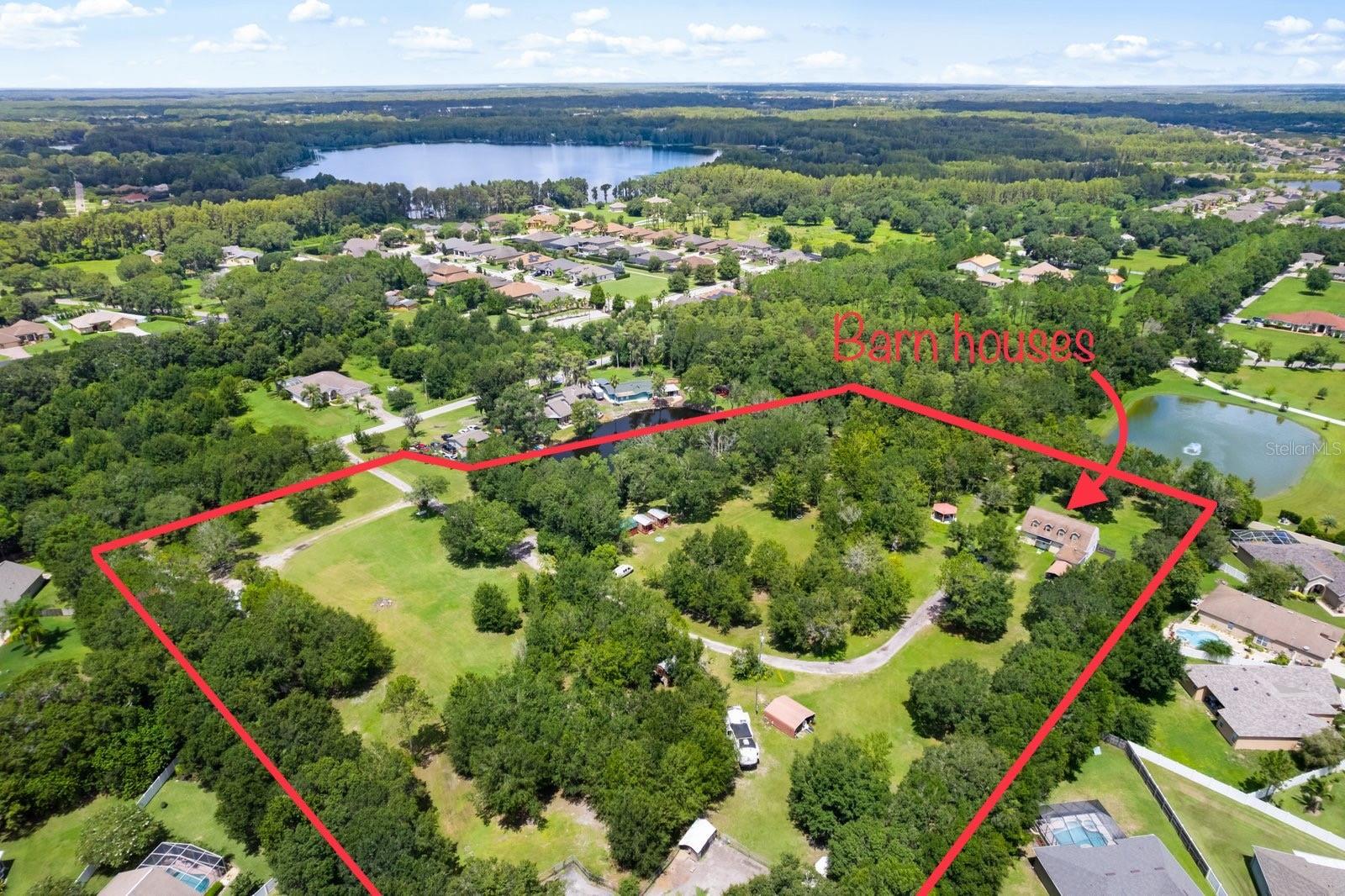 This price drop presents a fantastic opportunity for interested buyers to take advantage of a great deal on a wonderful property. Don't miss out on this chance to make this home yours at a more affordable price."Land and Lots of it! The possibilities are endless with this 7.79 Acre Property. No HOA, No CDD, No restrictions, High, Dry, Cleared land and around 0.79 acres of Lake Frontage! In addition to being completely fenced and gated this property has 265’ of road frontage and is currently zoned agriculture residential! Private Septic, Well, Electricity, & Cable with the option to connect to public water and sewer at the front of the property. Perfect for a large family who wants to build homes and stay close by or investors looking to add more homes. Future Land Use is 6 homes per acre allowing for substantial growth. Beautiful lush land as far as the eye can see, One 3 Bedroom, 2 Bathroom home sits on the lot currently with 1,432 heated sqft. Upstairs area currently used for storage with electric and plumbing hookups allowing for additional bedrooms/bathrooms to be added upstairs (must add AC to upstairs area). Interior features walls hand-painted by a professional, local artist! Updated kitchen with newer appliances, walk-in closets, with plenty of storage upstairs and around property! Beautiful lake sits on the property with a fountain, and a gazebo perfect for hosting on those cool Florida winter nights. Located nearby plenty of popular stores and shops as well as Cypress Creek Preserve & 11-Acre Plantation Palms Golf Course!