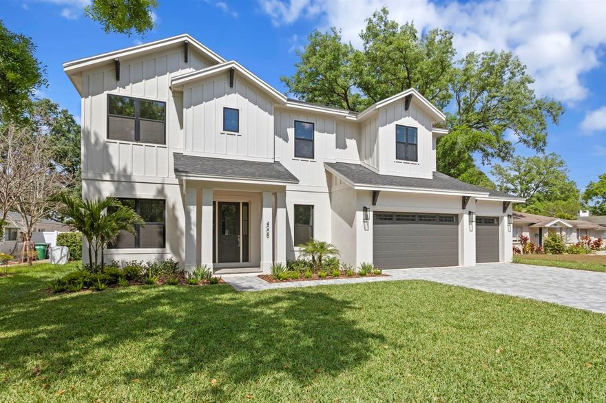 Newly completed (March 2025), move-in ready! This stunning new construction home boasts a HUGE backyard and a prime location just a short walk from top-rated schools, popular restaurants, bars, and coffee shops. Nestled on a picturesque tree-lined street and safely situated high and dry outside the flood zone (Flood Zone X). Designed with meticulous attention to detail, the home features an oversized 3-car garage with extra room for your golf cart, as well as a heated saltwater pool, spa, and outdoor kitchen—perfect for entertaining. Impact-rated windows and doors ensure safety and durability. Inside, the home impresses with wide plank white oak engineered hardwood, upgraded tile, custom cabinetry throughout, fully built-out custom closets throughout the home (including linen closets and pantry), level 4 smooth drywall, spray foam (icynene) insulation, 10’ ceilings on both floors, solid core 8’ interior doors, and crown molding. The first floor showcases an expansive open-concept kitchen with ceiling-height shaker cabinets, a large island, Monogram appliances, quartz countertops, and a sunlit breakfast nook. Large sliders in the great room showcase your massive backyard and lead out to a spacious lanai, outdoor kitchen & pool area with an upgraded travertine pool deck. The well-designed floor plan includes a formal dining room connected to the kitchen via a butler's pantry, a study with glass French doors, a cute mudroom off the garage, a powder bath, and a first-floor guest suite with an en-suite bathroom that doubles as a pool bath. Upstairs, the large primary suite offers two huge closets and a luxurious bathroom covered in carrera marble with a full wall vanity, frameless glass shower, and freestanding tub. Two bedrooms share a Jack & Jill bath, while another bedroom has its own en-suite. Additional amenities include a well-equipped laundry room and a large media/game room that could serve as a sixth bedroom. Underground electric, helping to prevent power loss during storms! This home sits on an expansive 81 x 124 lot, perfectly set back from the street with a paver driveway for added curb appeal. In the sought-after Grady, Coleman, and Plant school district, this property combines modern luxury with an unbeatable location.
