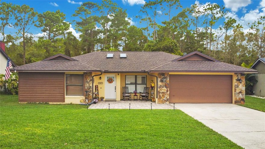 Located in Alafaya Woods on an oversized 0.35-acre lot in a cul-de-sac, this 3-bedroom, 2-bathroom home offers a well-designed layout with multiple living spaces, updated features, and a two-car garage! The floor plan includes a living room, separate dining area, and a spacious family room with a fireplace. French doors in both the family room and the primary bedroom lead to the backyard, offering easy indoor-outdoor access. The kitchen and tile flooring throughout the living area was updated in 2022. Details like plantation shutters in the kitchen and living room add character. All bedrooms feature walk-in closets, and the primary bedroom features an updated primary suite. Two additional bedrooms have a full bath to share. Key mechanicals, such as the brand-new roof and 2023 water heater have been taken care of! The exterior offers mature surroundings and privacy, with local deer often passing through. Located just minutes from Alafaya Trail/SR 434, and Mitchell Hammock, this property is close to Publix, restaurants at Alafaya Square, and Oviedo on the Park, home to community events, dining, and shops. Neighborhood amenities include tennis courts, a basketball court, and a playground. Short drive to Twin Rivers Golf Club! If you're looking for a home that offers space, function, and location, schedule your private showing today.