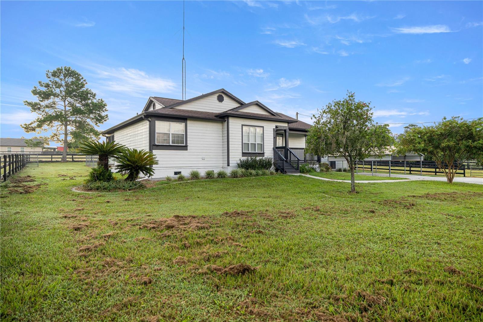 Located less than 2 miles from the World Equestrian Center and close to local amenities, this freshly painted 3BR/2BA home on 2+ acres is move-in ready. Interior highlights include new flooring, an eat-in kitchen, and washer/dryer. Exterior features include an enclosed lanai, 2-car carport, storage shed, and a fenced backyard for pets. Horses considered on a case-by-case basis. Lawn care included. Fantastic location—this rental will not last!