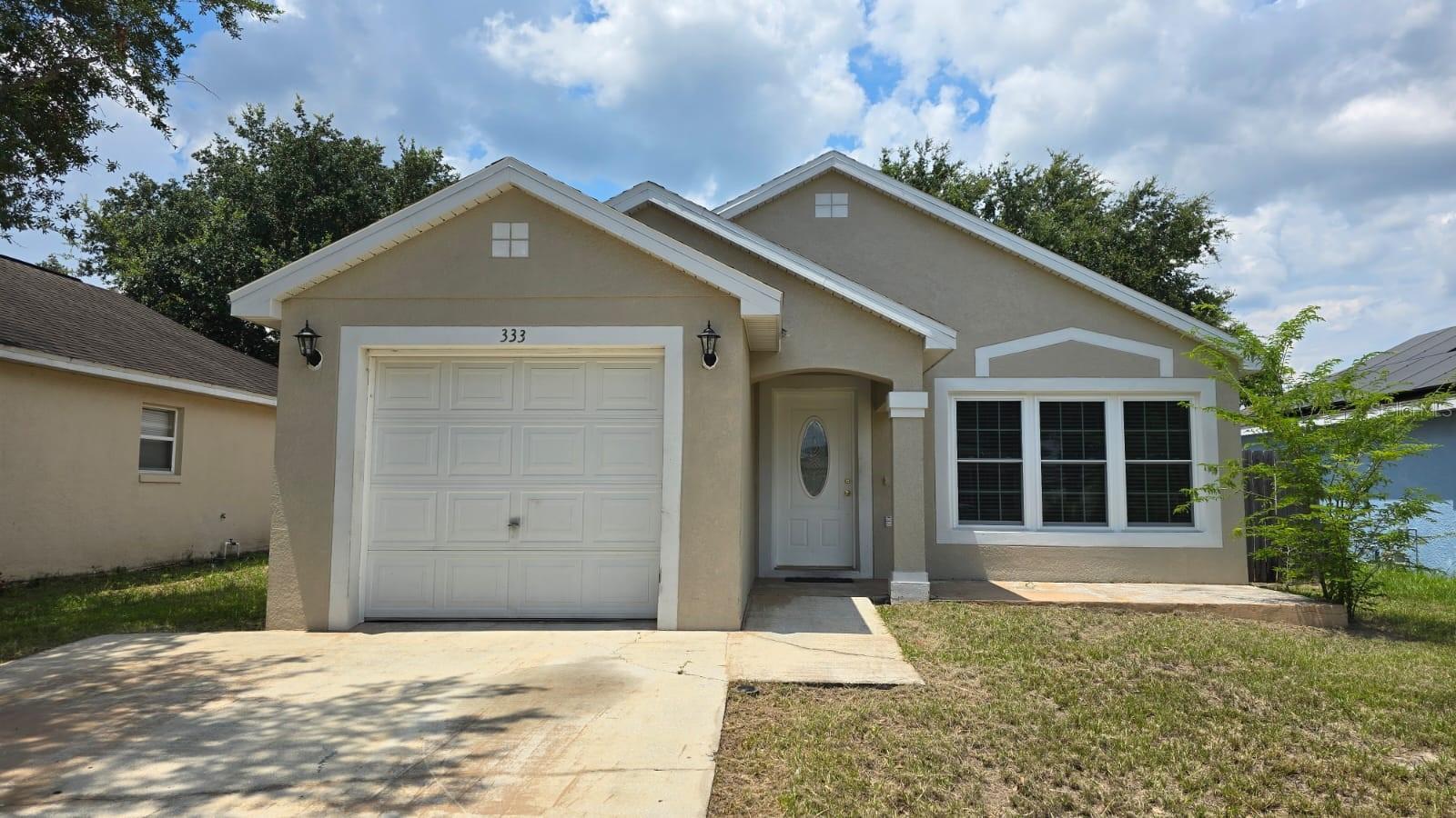 Quaint, cozy & well-maintained 3 Bed/2 Bath Single Family in gated community of Royal Ridge. Split plan home with Kitchen/Living/Dining combo. Spacious eat-in kitchen includes all appliances. A large master suite features walk-in closet & ensuite bath with garden tub/shower combo. Secondary bedrooms are generous in size. Upgraded laminate floors throughout home. Washer and dryer are included. One car garage & no rear neighbors!! Gated community with playground. Great location short distance to all amenities, major roads, Posner Park, Advent Health Heart of Florida Hospital, Champions Gate, restaurants, theme parks.