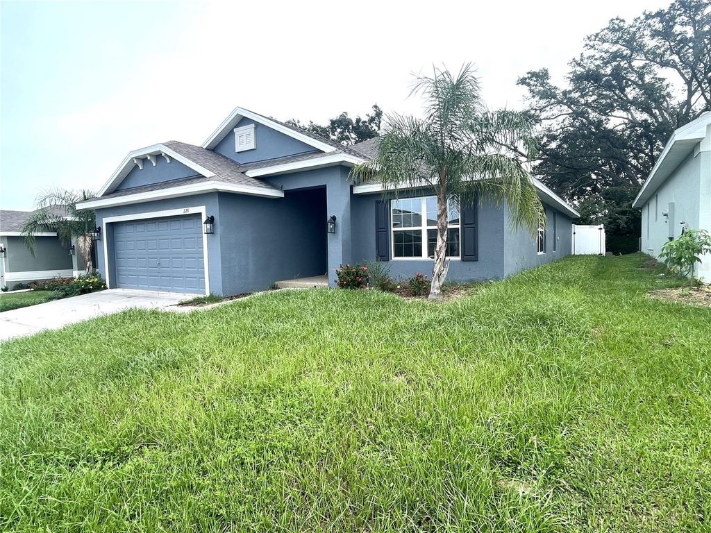 Photo of 228 Krenson Bay Loop, Winter Haven, FL 33881 (MLS # O6349627)