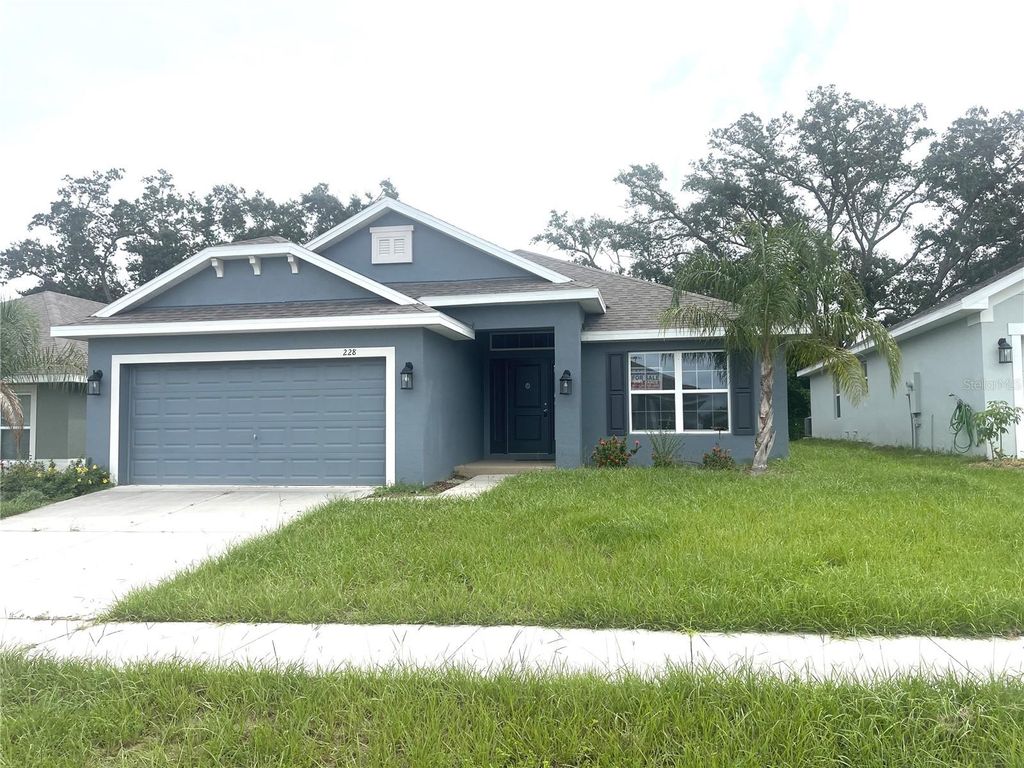 Photo of 228 Krenson Bay Loop, Winter Haven, FL 33881 (MLS # O6349627)